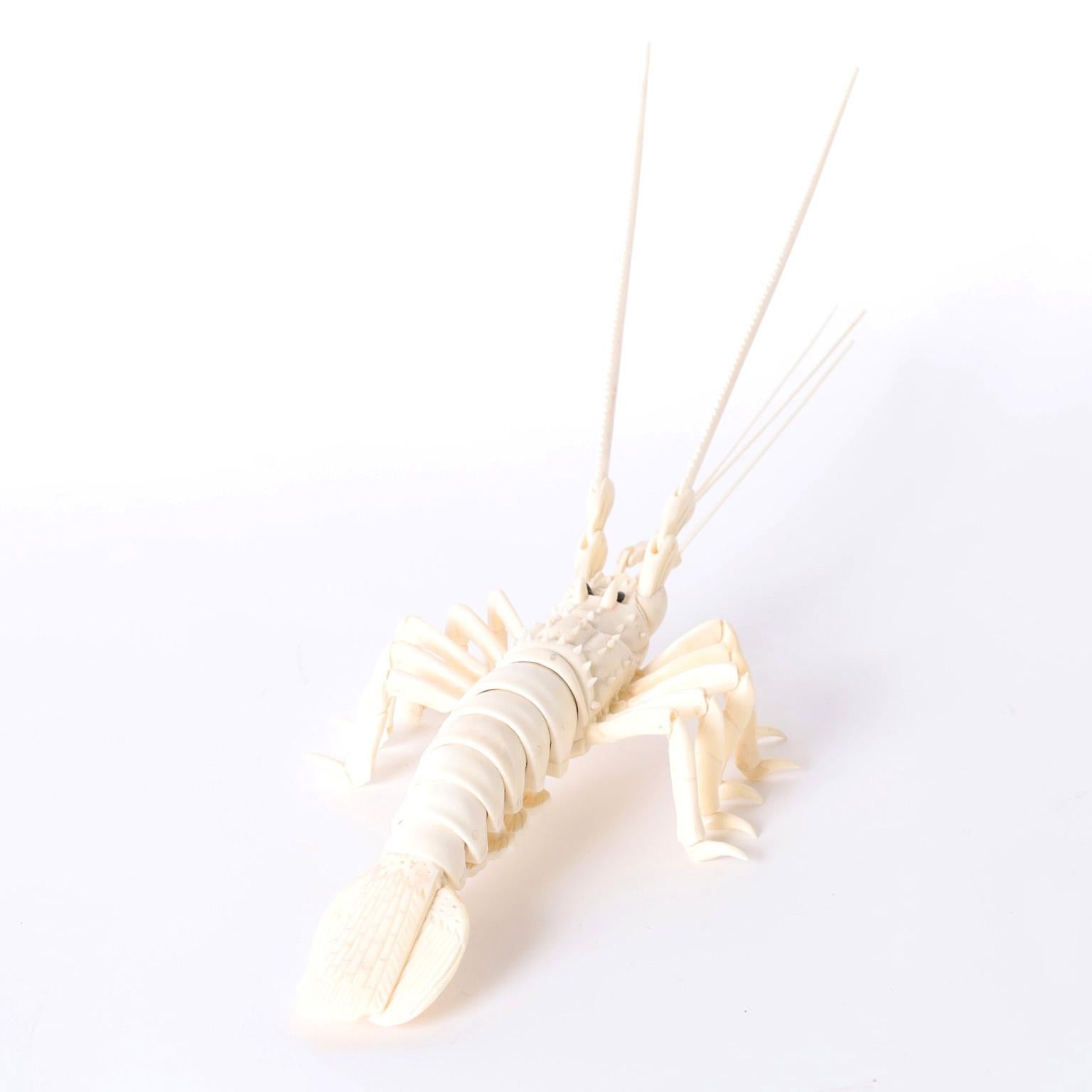 Lobster sculpture or object of art crafted in carved bone with hinged antennae and flexible tail. Our other listings contain. a larger lobster, crabs and turtles.
These are no longer being made.