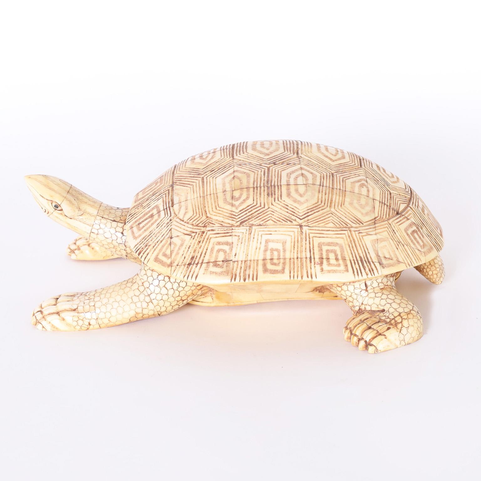 Whimsical turtle sculpture or object of art crafted in carved bone with an organic palette and amusing stylized form.