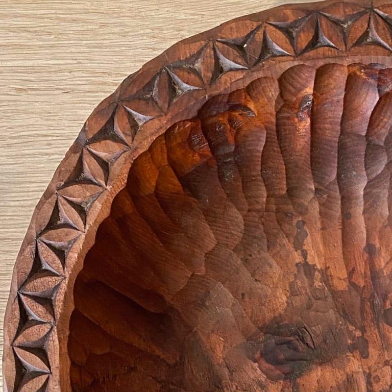 Carved wood bowl in the style of Jean Touret. 
Marolles, France, c. 1950s.