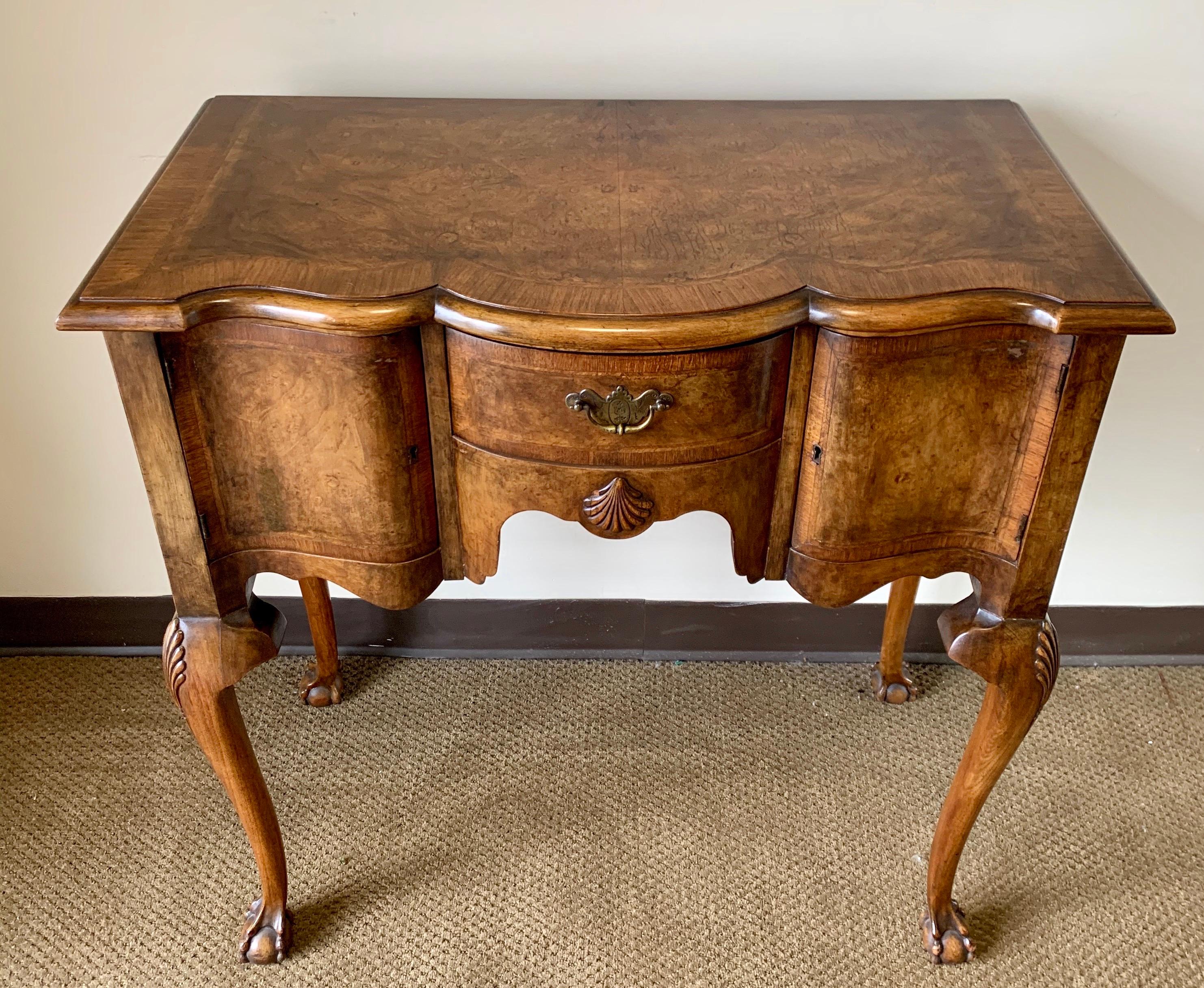 Coveted carved burled walnut console table The table has storage and key to lock which make the possibilities endless. Dry bar, console table, accent table, foyer piece - your call!