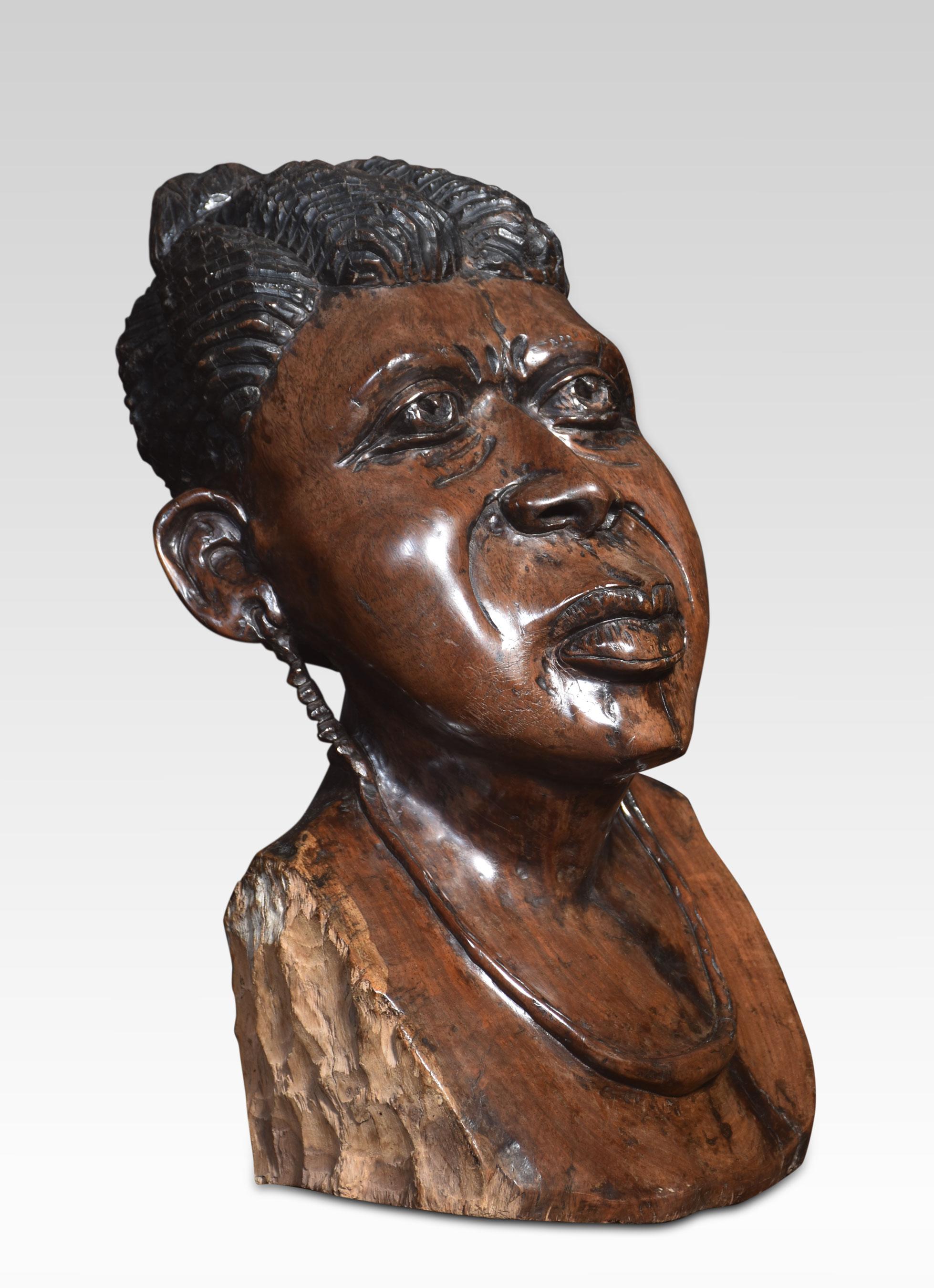 Finely carved wooden bust of a striking tribeswoman figure carved from an exotic hardwood with a rich patina free standing.
Dimensions
Height 22 Inches
Width 13 Inches
Depth 17 Inches