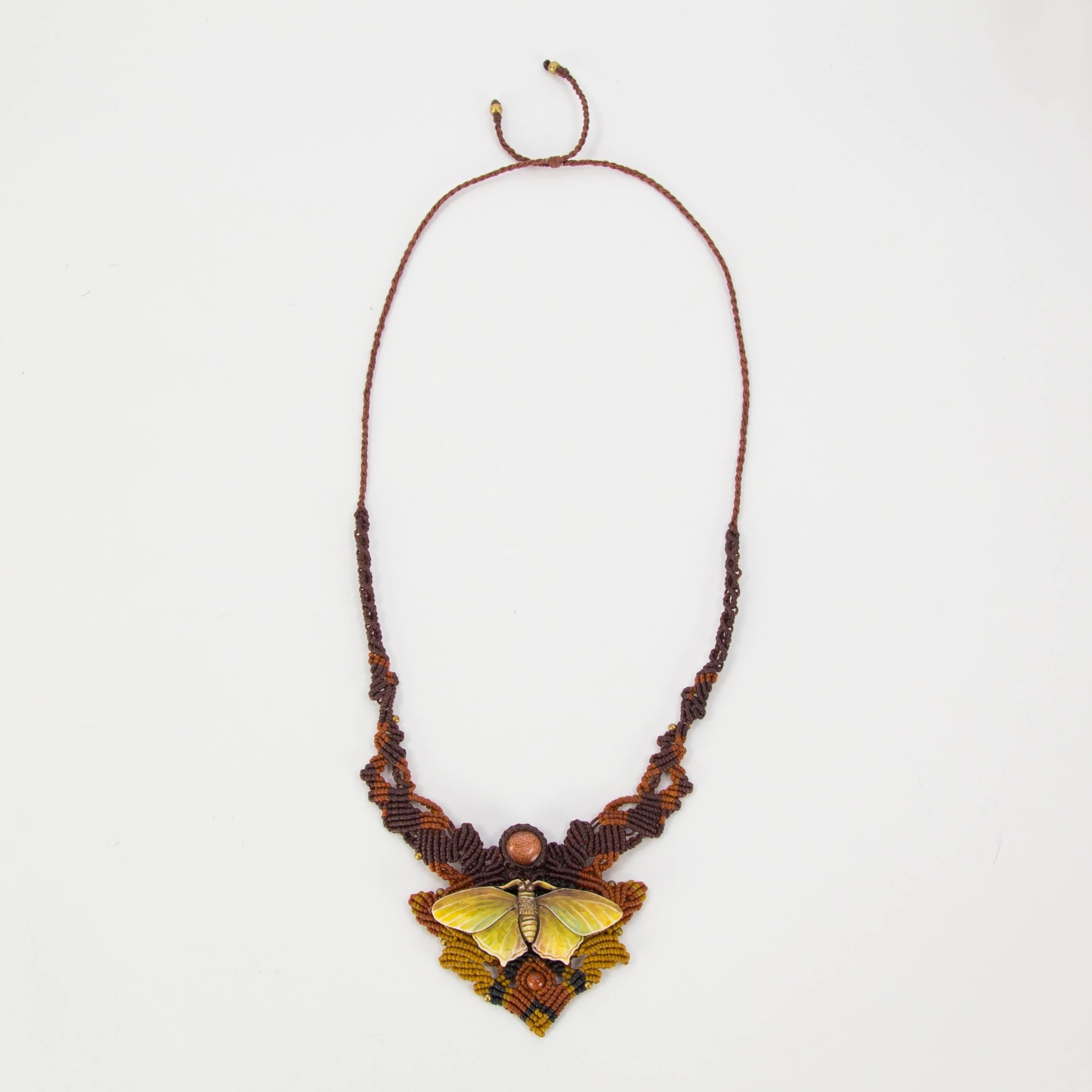 This beautiful necklace is hand carved bone and hand colored by a master Balinese painter, it speaks to the thrill of a butterfly landing on an outstretched finger and a sense of awe that moment brings, likened to a Garden Kiss. Set on an intricate