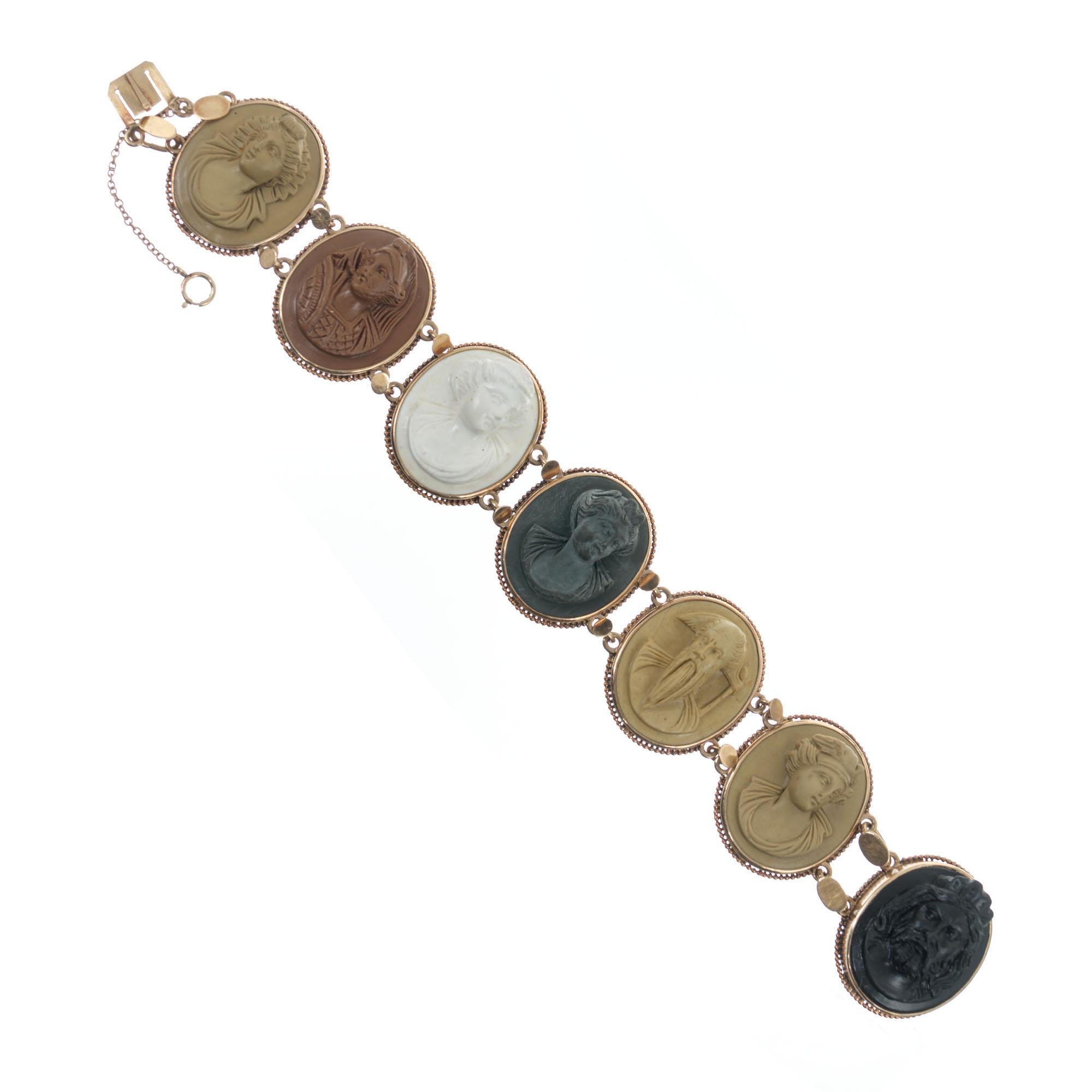 Handmade 14k rose gold Cameo bracelet.  Circa 1890's with seven carved lava high relief cameos of different natural untreated colors. 8 inches in length. 

7 oval high relief multi color lava carvings, 26mm x 22mm 
14k rose gold 
Stamped:  Not
51.1