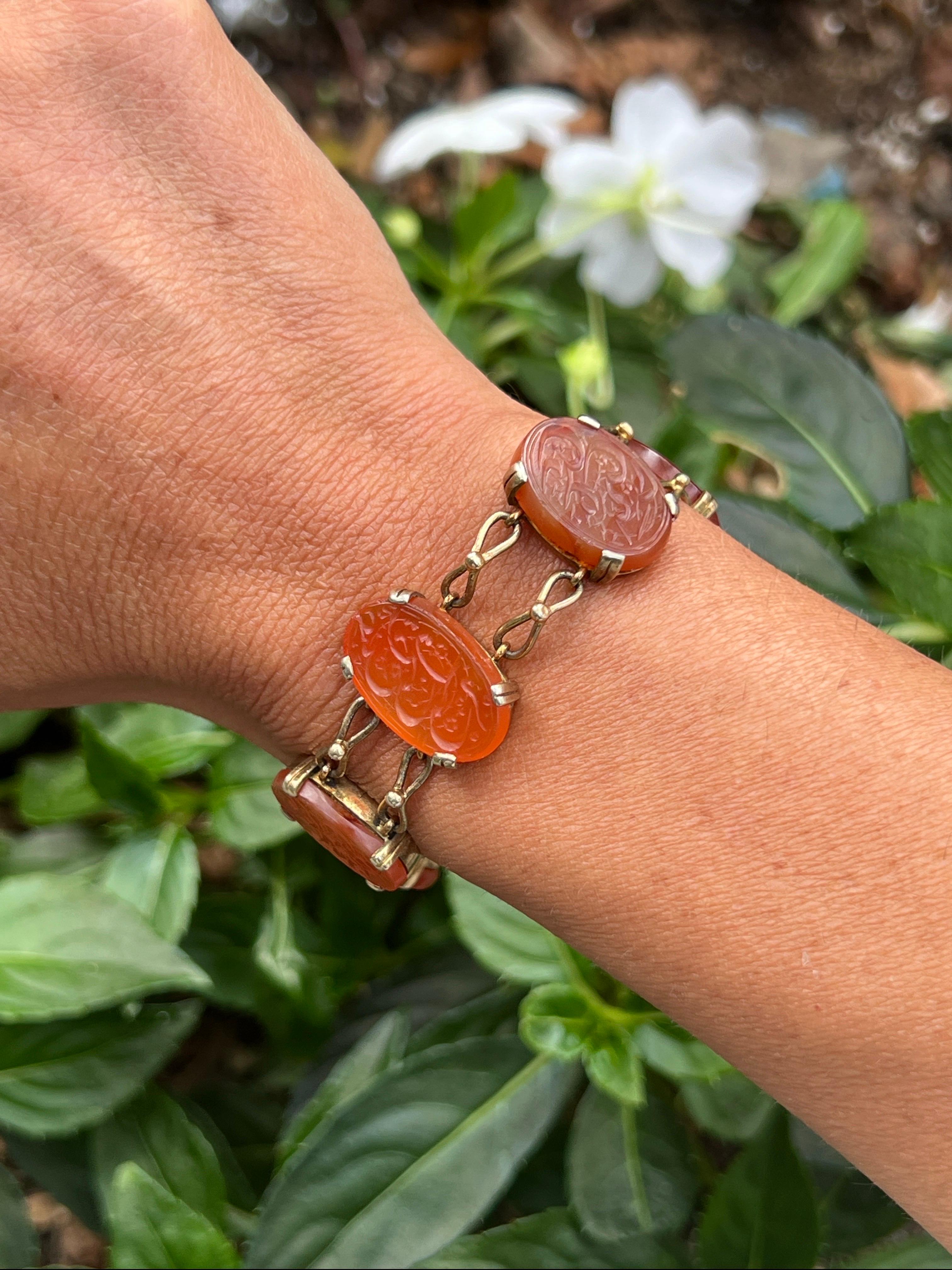 Carved Carnelian Islamic Calligraphy  Bracelet

A bracelet featuring seven carved carnelian with carved Islamic calligraphy
Measurements: 7.75