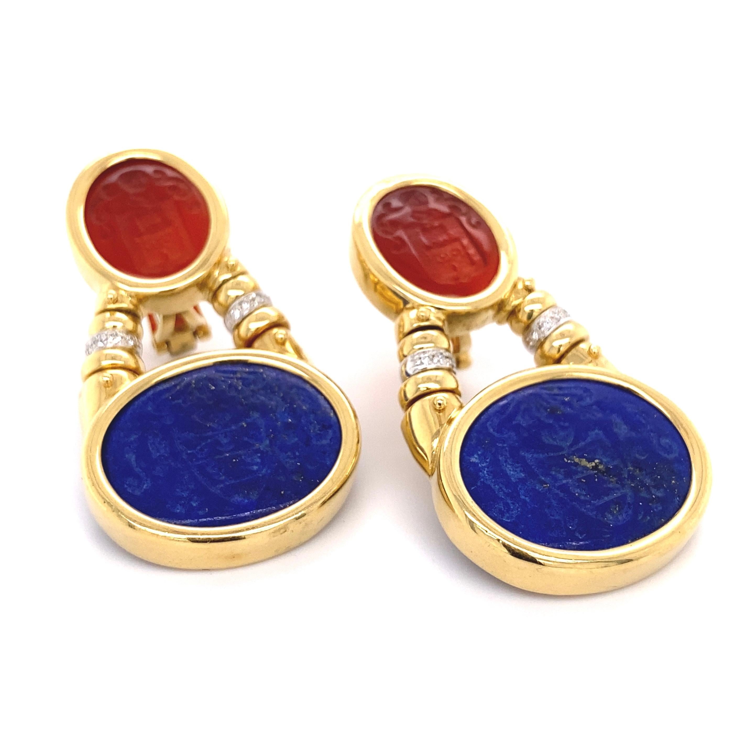Simply Beautiful! Finely detailed Dangle Earrings. Carved Carnelian on top, carved Lapis Lazuli at bottom, enhanced with Diamond rondelles in between the Gemstones, weighing approx. 0.15tcw. Hand crafted in 18K yellow Gold mounting. Marked: Italy,