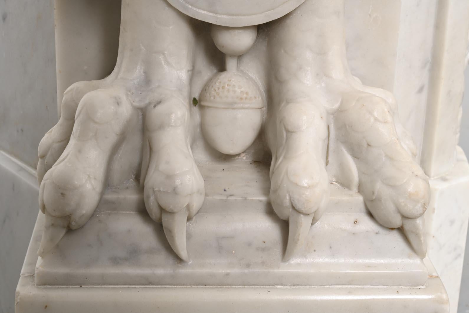 Carved Carrara marble mantel in the Napoleon III style with winged lions For Sale 2