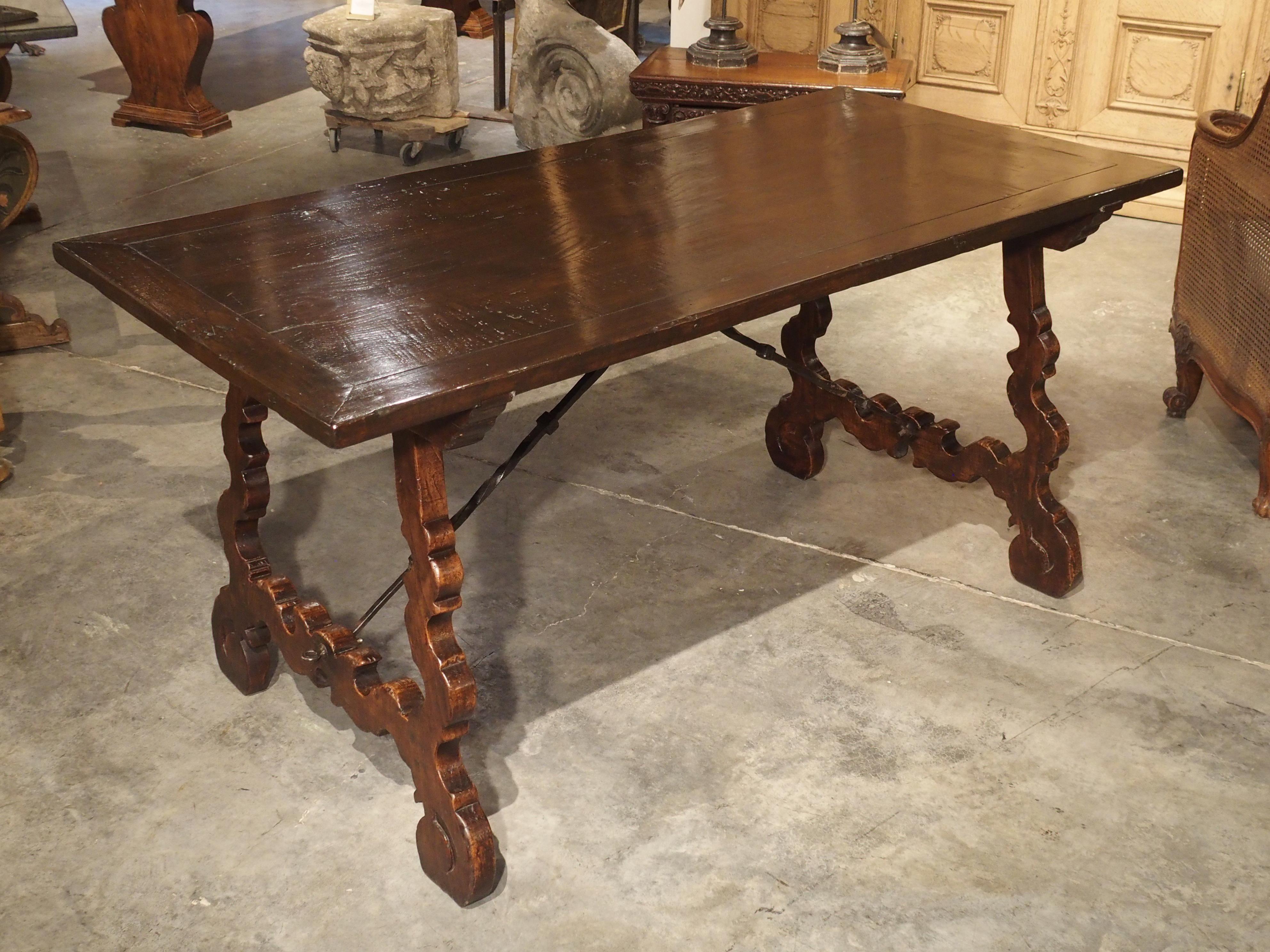 Spanish Carved Catalan Table with Lyre Legs and Wrought Iron Supports