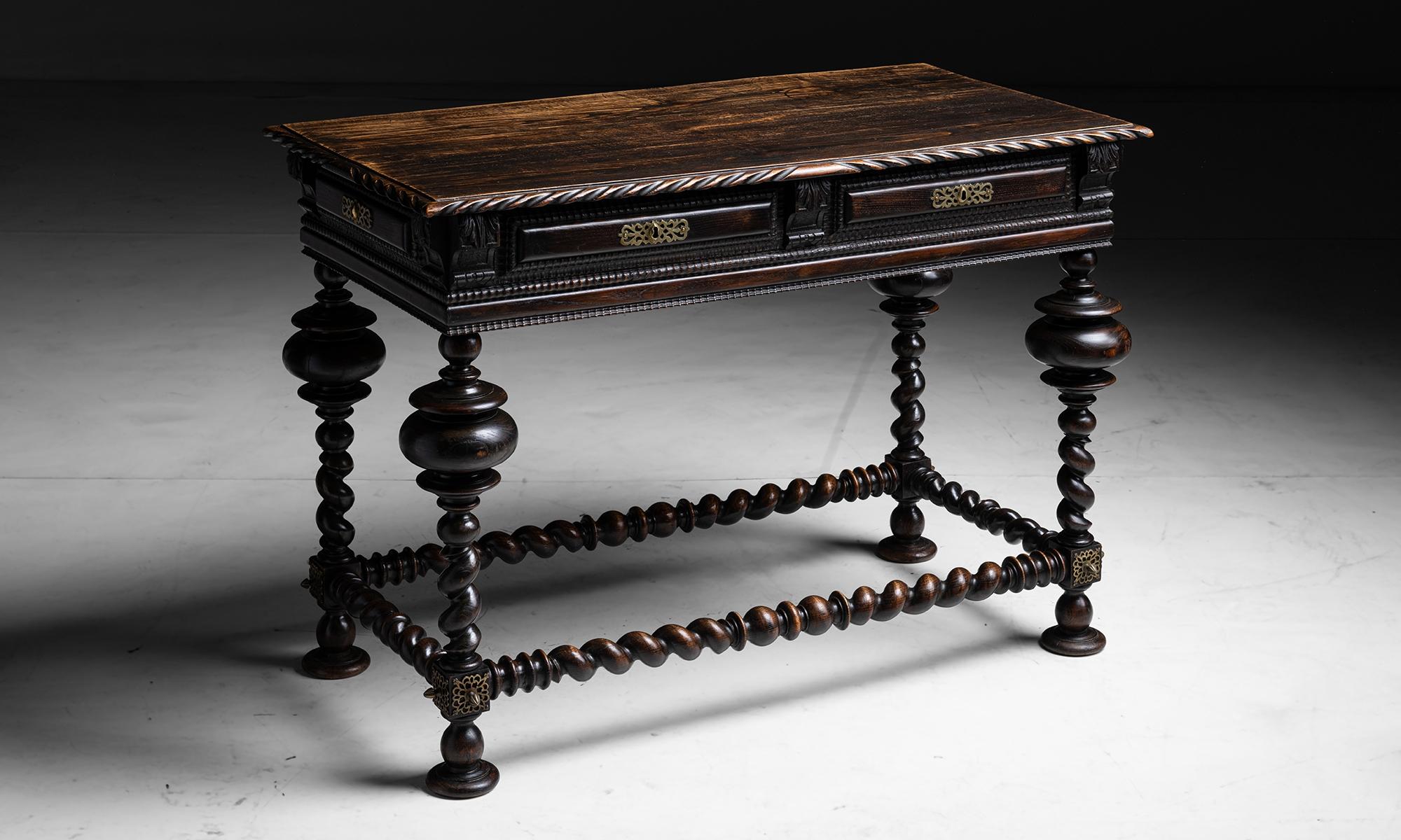 Carved Centre Table

Portugal circa 1870

Detailed carving Barley twist legs and supports, single drawer, faux drawers on side and back, with original brass hardware.

45.5”L x 23.25”d x 32.5”h

Ref. TABLE1146