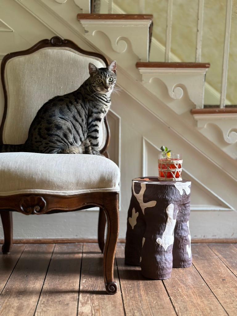 American Carved ceramic cocktail table with stylized vegetal pattern in cream and brown   For Sale