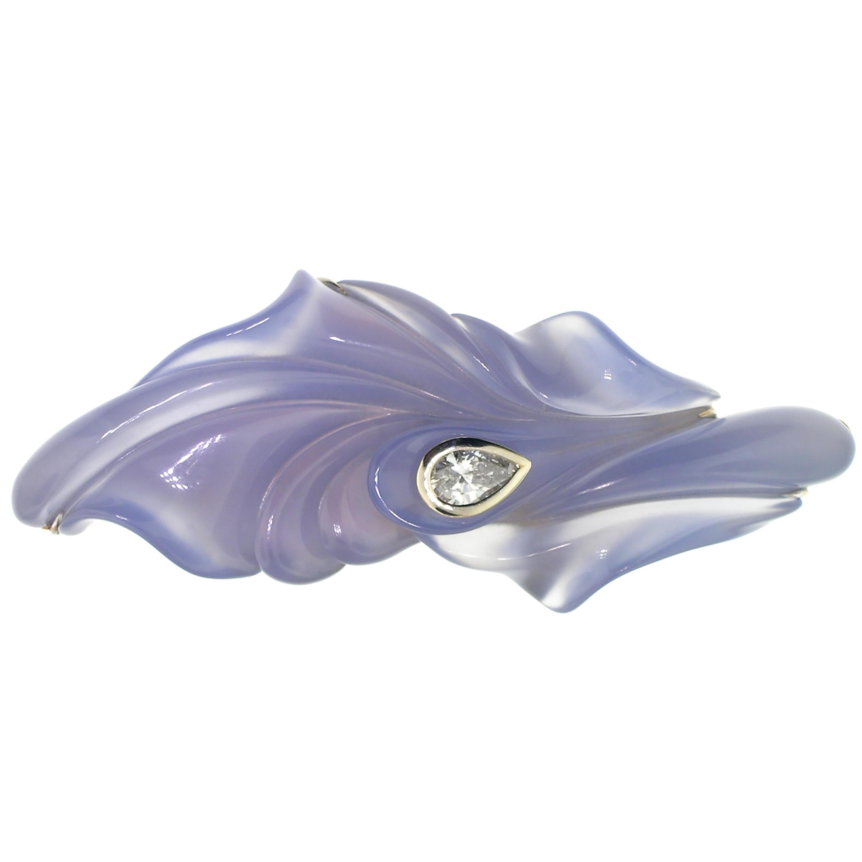 This exquisite sculpture was carved in luxuriously luminescent blue chalcedony by American lapidary master Steve Walters. The drama in this piece of jewelry cannot be overstated; the large scale of the exquisite chalcedony and the gorgeous movement