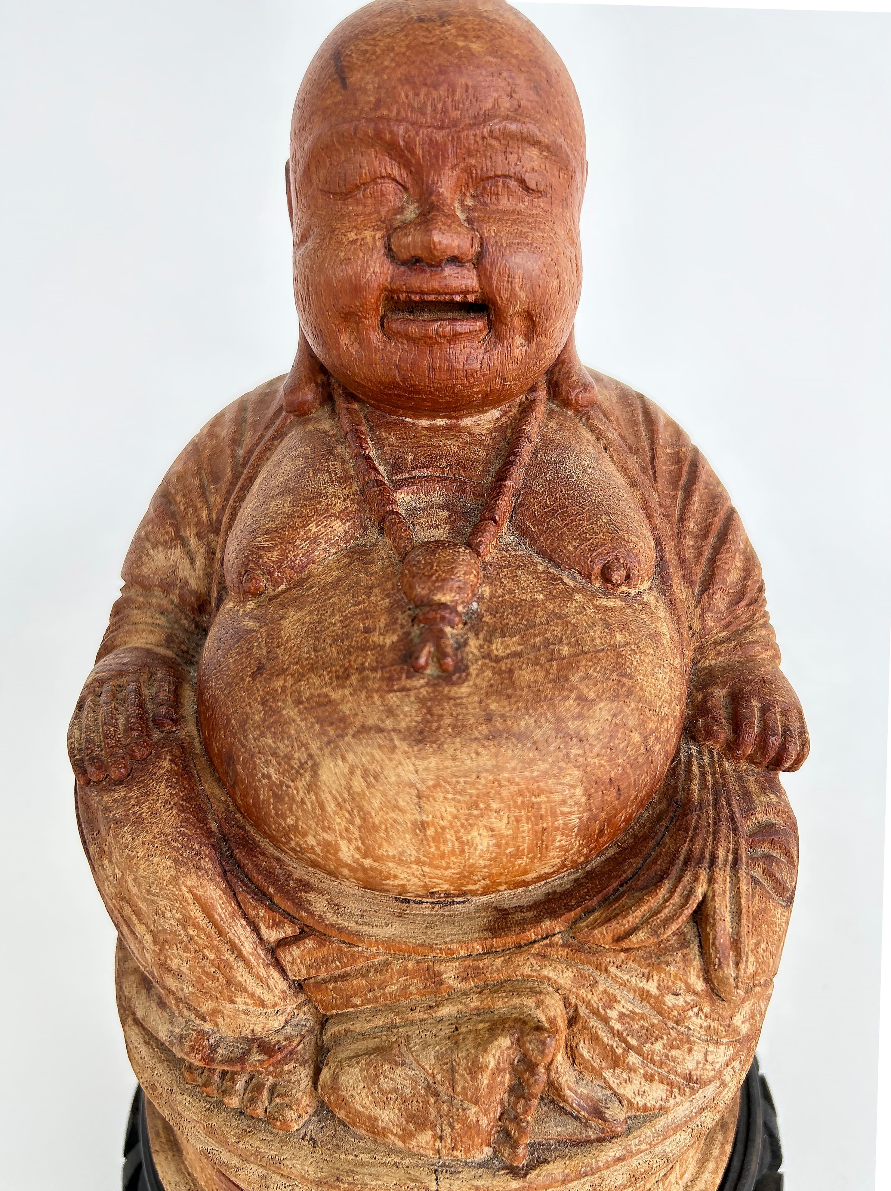 Carved Chinese Figure of Buddha on Carved Base, Signed to the Underside

Offred for sale is a carved wood Buddha figure that rests upon a carved wood base. The base doesn't appear to be original. The title 'Buddha', which literally means 'awakened',