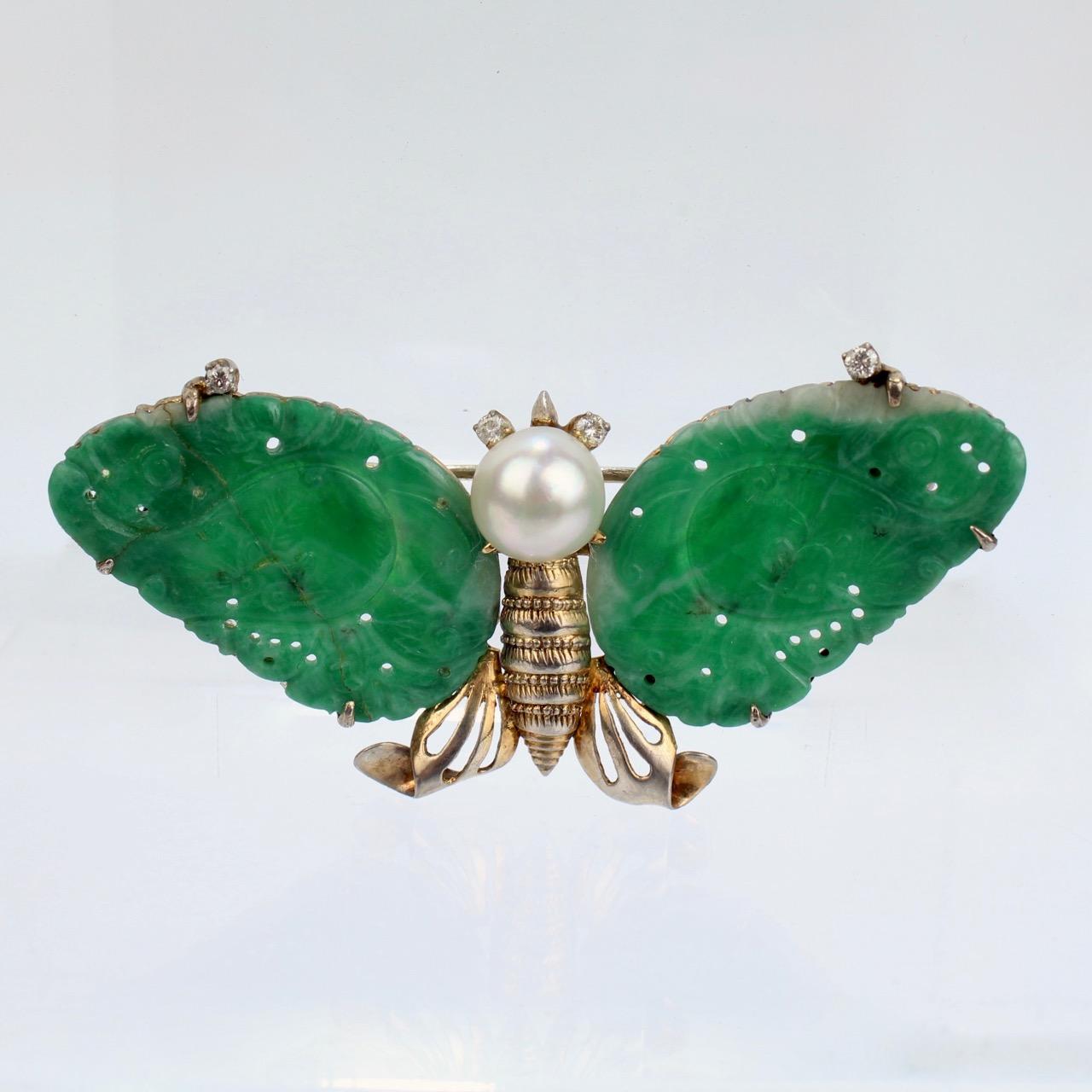 A fine old or antique Chinese butterfly brooch or pin.

In 14k yellow gold.

Set with carved jadeite plaques as wings, a round white pearl for the head, and small round diamonds as eyes. 

Simply a wonderful figural brooch!

Date:
20th