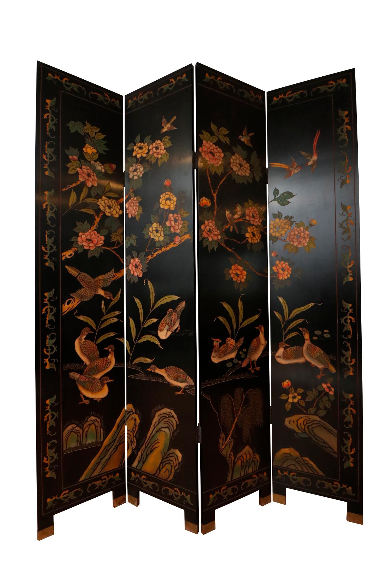 A Chinoiserie four panel folding screen or room divider with elaborate scenes carved on both sides. The front is lavishly decorated with a 'Joseph's Coat' rose bush with yellow and pink flowers. Grouse, sparrows and birds of paradise give the scene