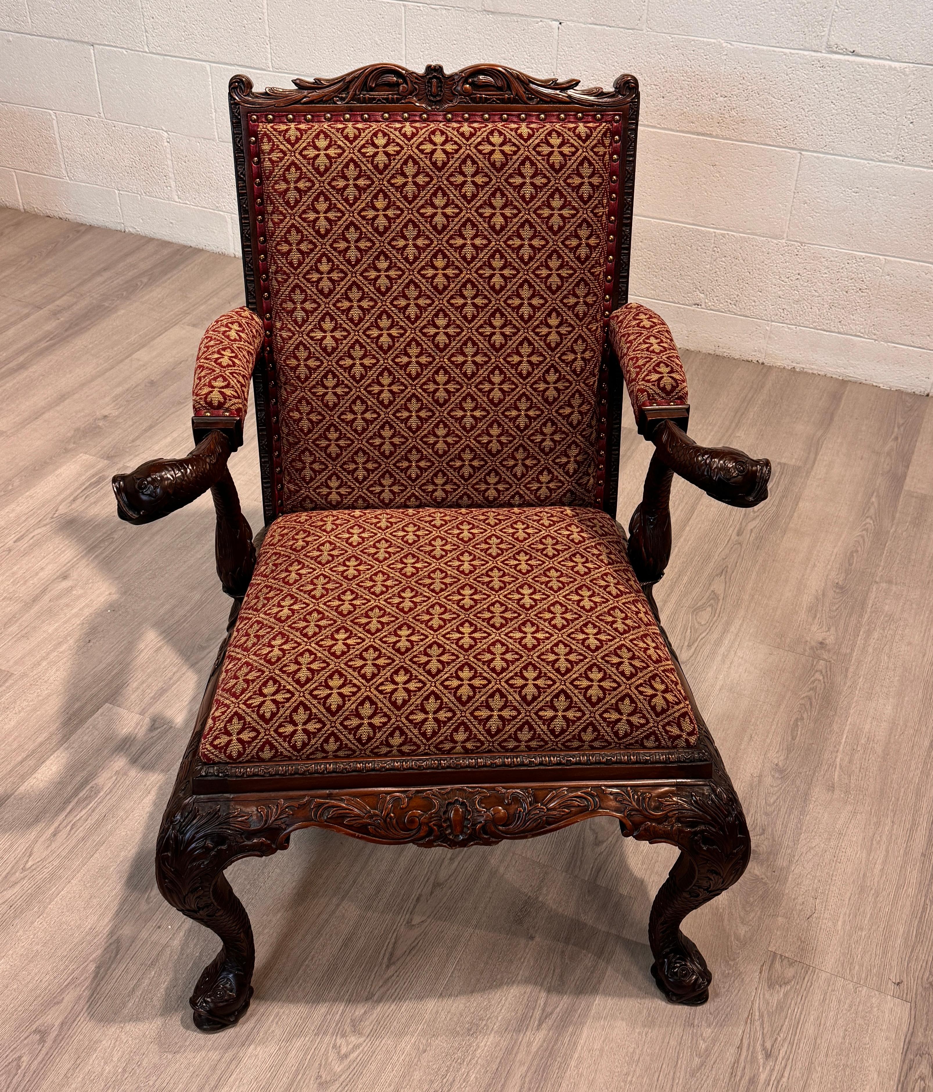 A fine example of Chippendale detail in this ornately craved arm chair.  This particular item came to us from Indonesia by way of England where it would have looked right at home in the finest of English libraries. The quality of  timber used gives