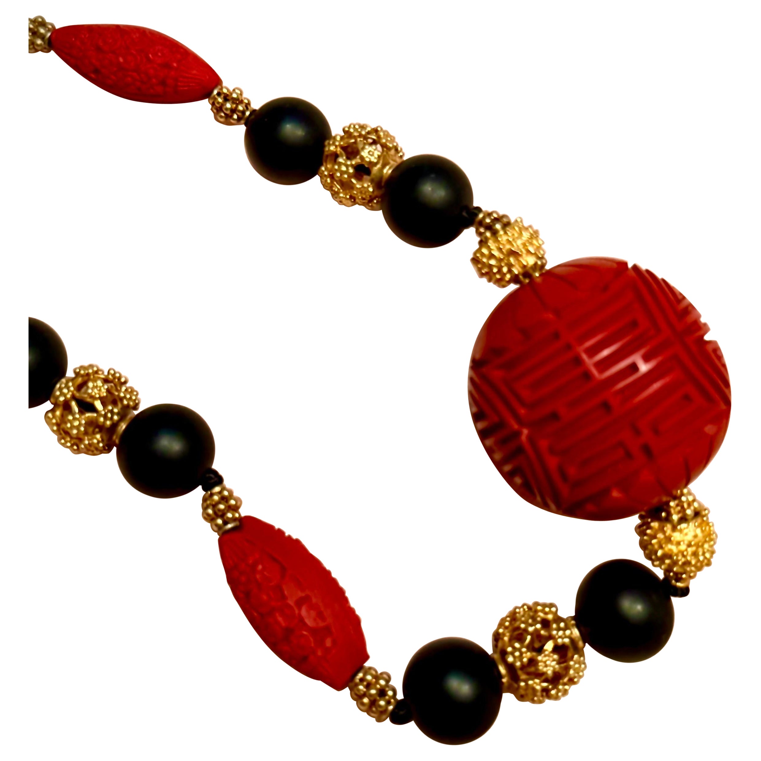 Carved cinnabar, ebonized wood and gilt sterling silver For Sale