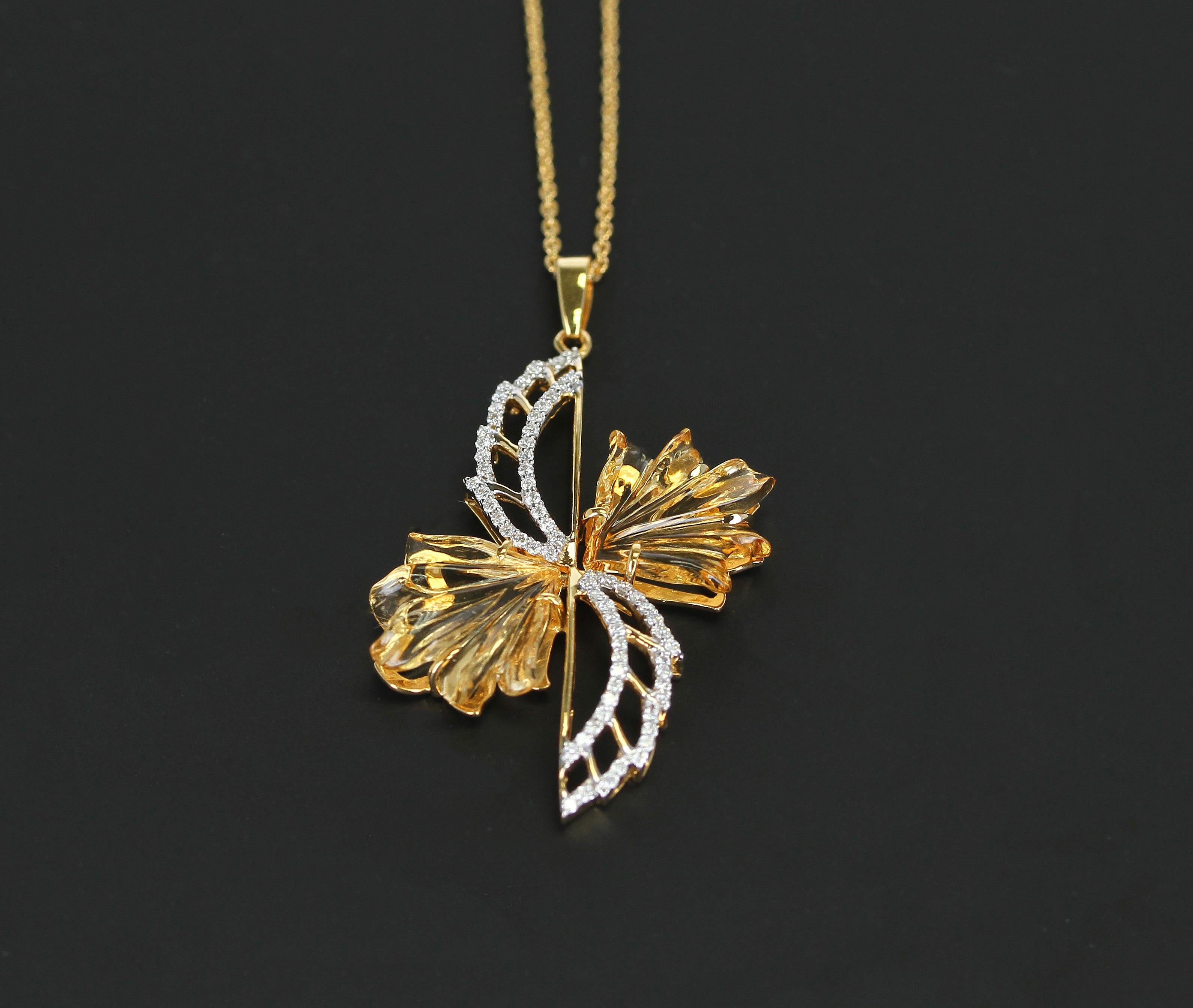 A beautiful and large pendant with carved Citrine and Diamonds as a wing design, with a chain. 14K Gold, Diamond Weight: 0.33 carats, Citrine Weight: 7.99 cts, Pendant Length: 1 & ¾”, Chain: 18