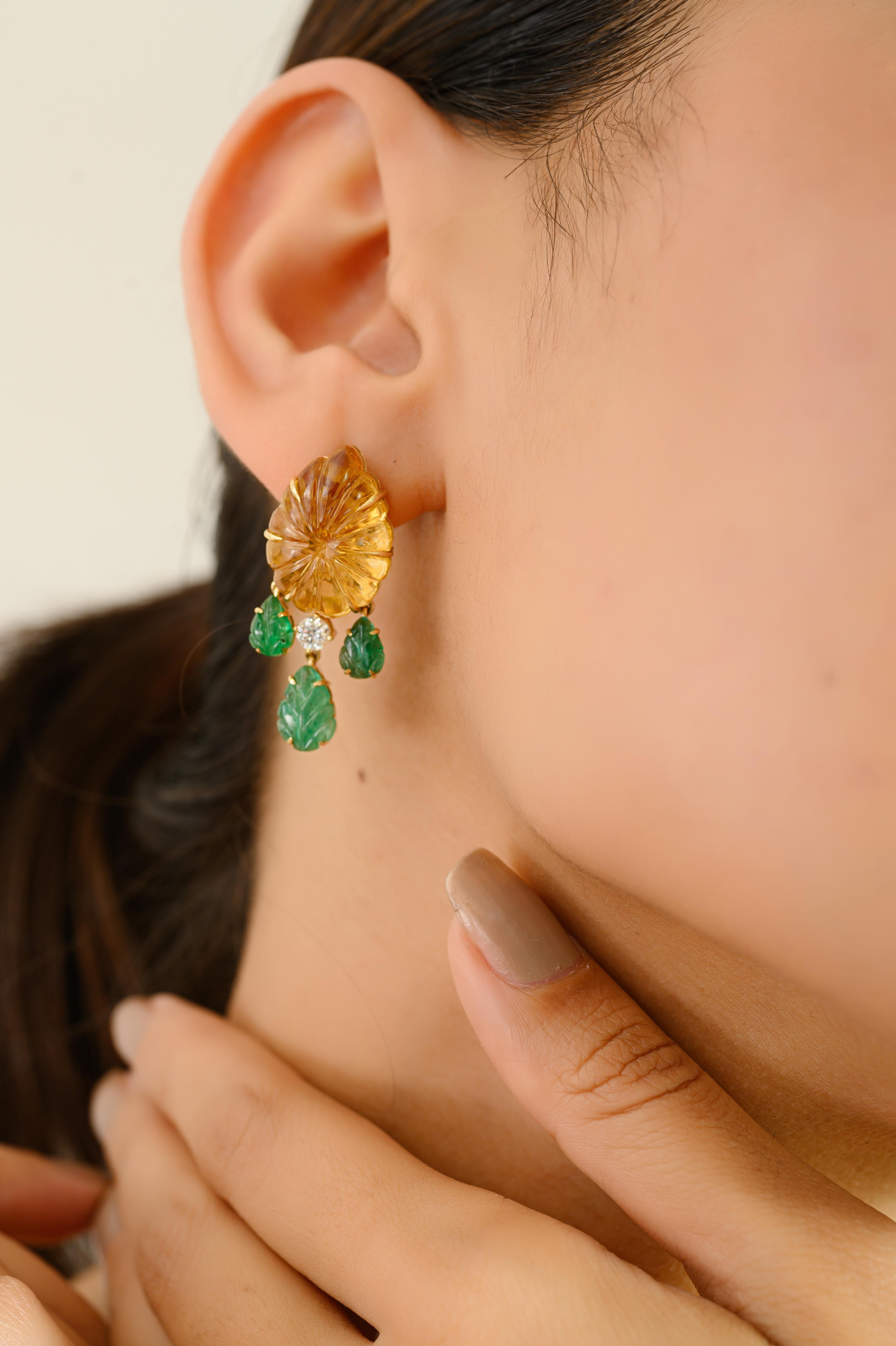 Elevate your collection with these exquisite 18k yellow gold earrings, a true celebration of artisanal craftsmanship and natural elegance. At the center of each piece is a beautifully hand-carved citrine, shaped like a blossoming flower, radiating