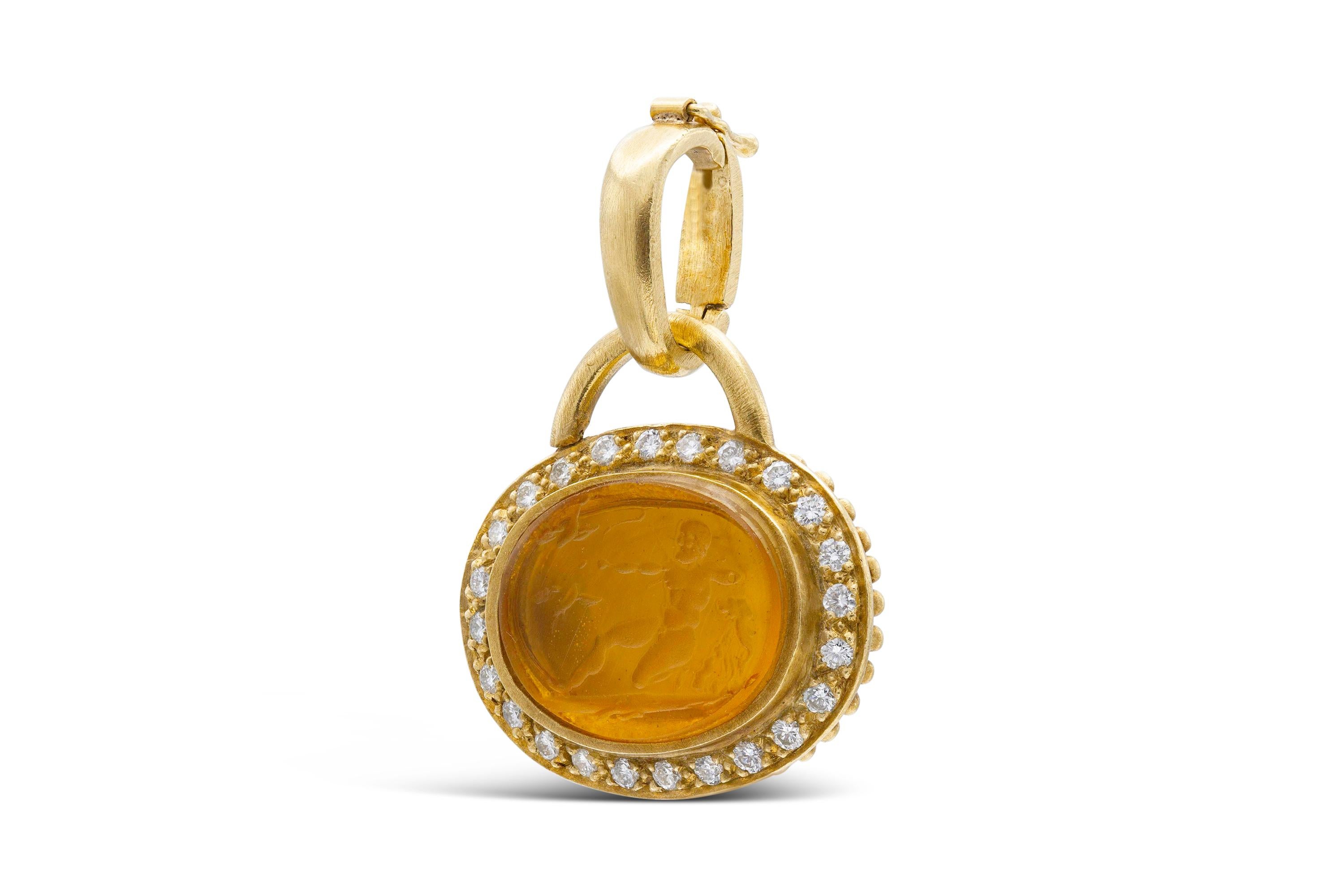 Finely crafted in 18k yellow gold with a carved Citrine intaglio, featuring Round cut diamonds weighing approximately a total of 0.60 carats.