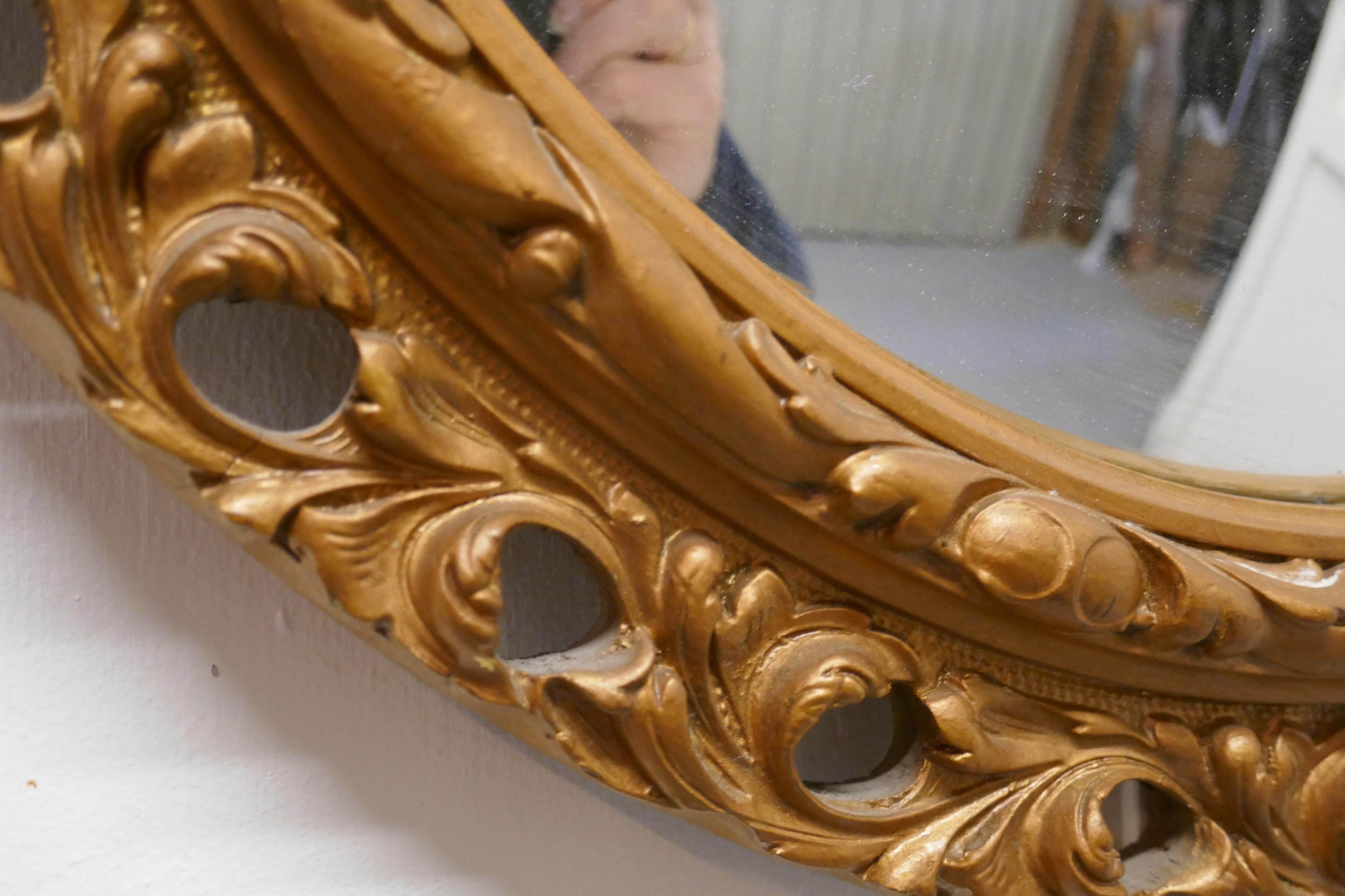 Carved convex gilt wall mirror 


This is a very attractive mirror has a 3” wide gilt frame which id carved and pierced and a convex looking glass 
The mirror is in good condition as is the original convex looking glass

The mirror is 19” in
