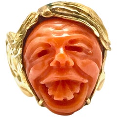 Carved Coral and Yellow Gold Goofy Face Ring