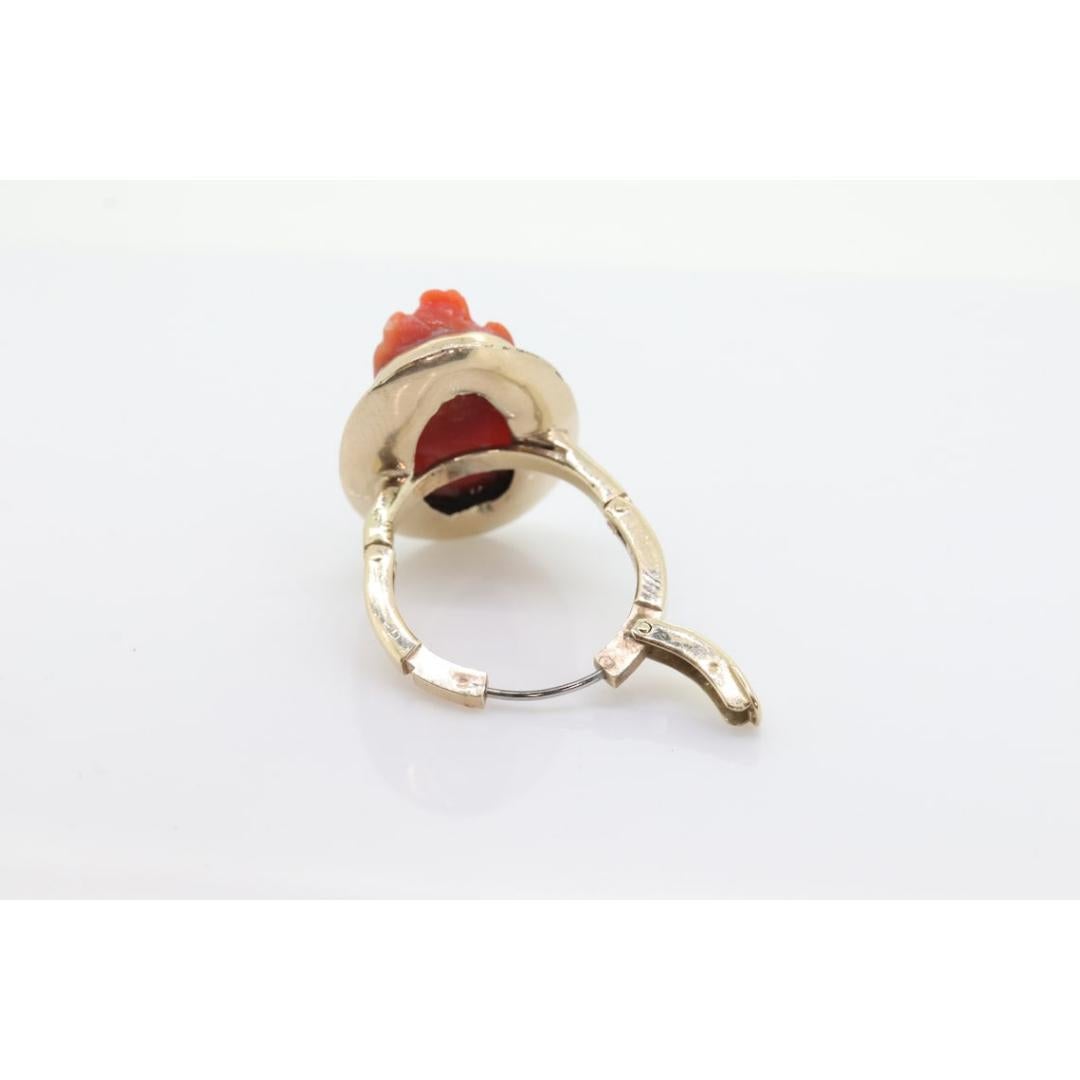 Vintage from the 1910s
Size: 3 US
Materials: Gold, Stone
Gemstone: Coral

Style: Art nouveau

An amazing addition to your collection.

Very petite ring. Carved cameo out of coral.

Carved Womens Bust.

Adjustable Knuckle ring for Arthritic or