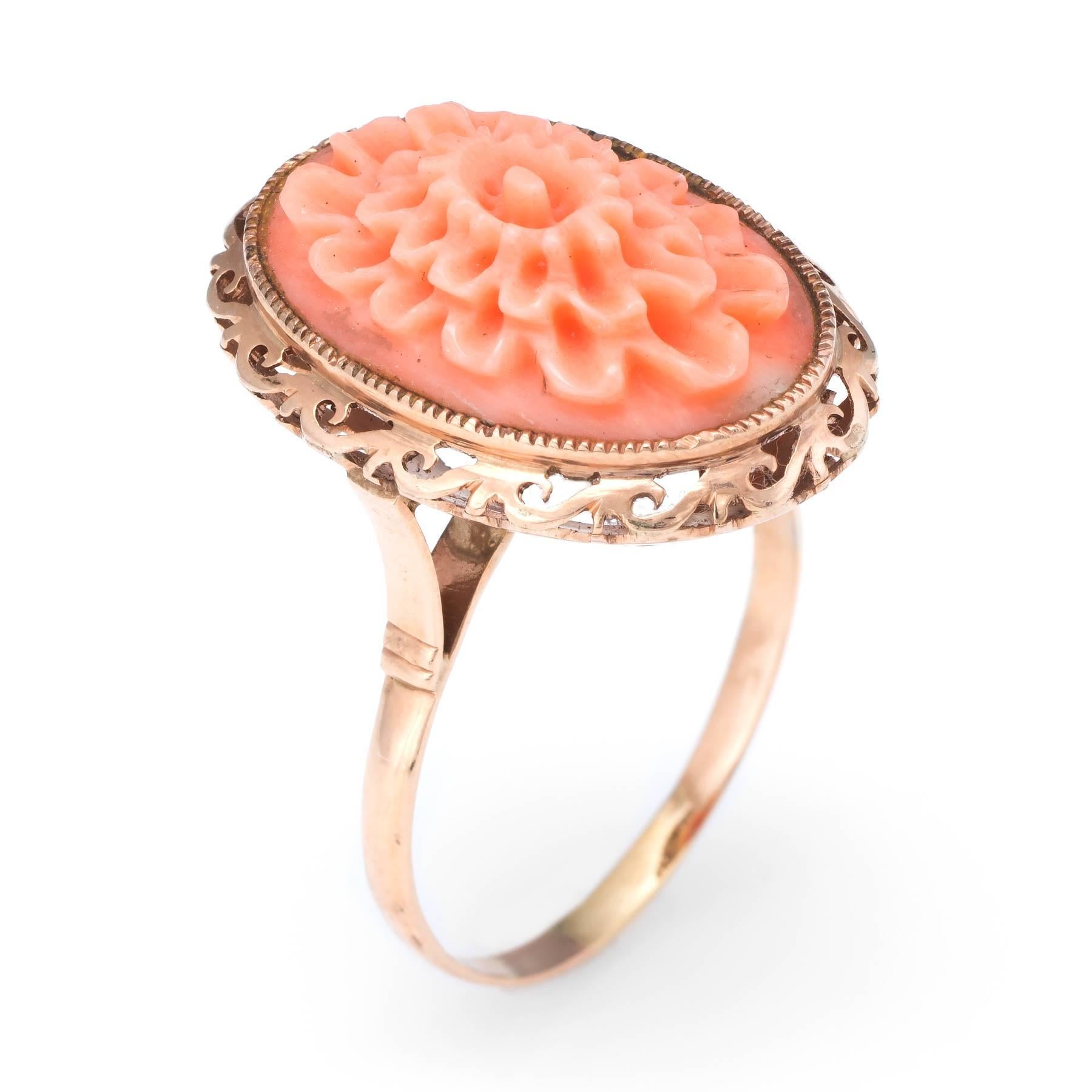 Overview:

Finely detailed vintage (circa 1950s to 1960s) cocktail ring, crafted in 14 karat yellow gold. 

Natural cabochon coral is intricately carved in the form of a blooming flower. The coral measures 20mm x 13mm (in excellent condition and