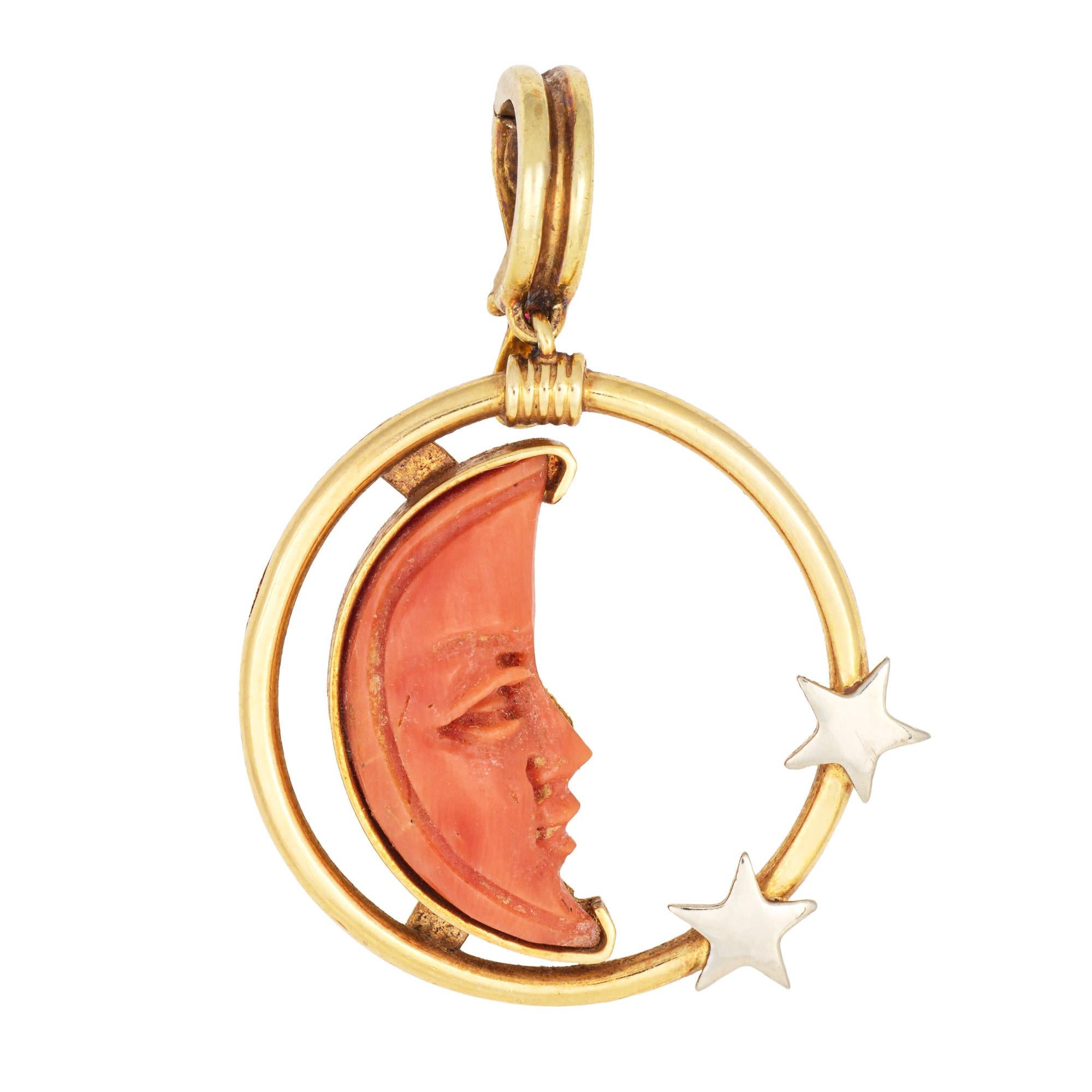 Finely detailed vintage Man in the Moon crescent moon & star pendant crafted in 18k yellow gold (circa 1970s).  

Carved coral measures 20mm x 10mm. 

The sweet pendant features a Man in the Moon motif carved in coral, set into a star themed design.
