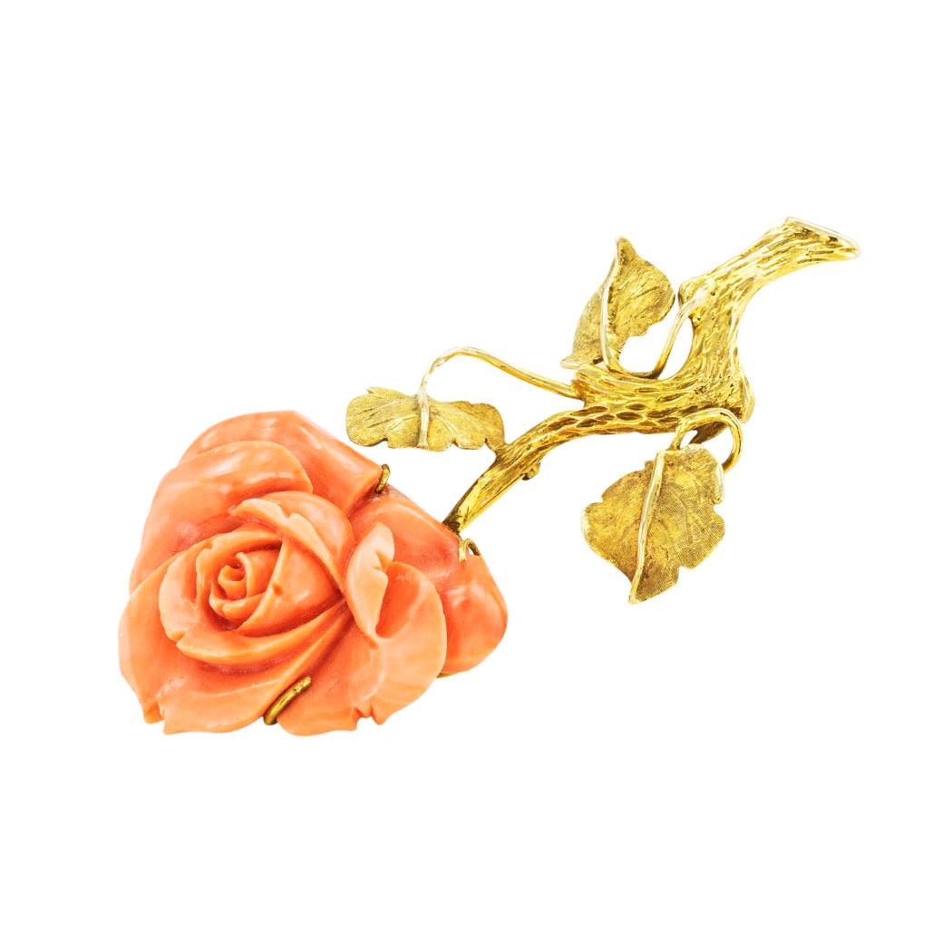 Carved coral and gold rose brooch circa 1960. *

ABOUT THIS ITEM:  #P-DJ93A. Scroll down for detailed specifications.  Designed as a flower stem showcasing a large rose flower carved out of coral.  The carving is so crisp that the petals appear as