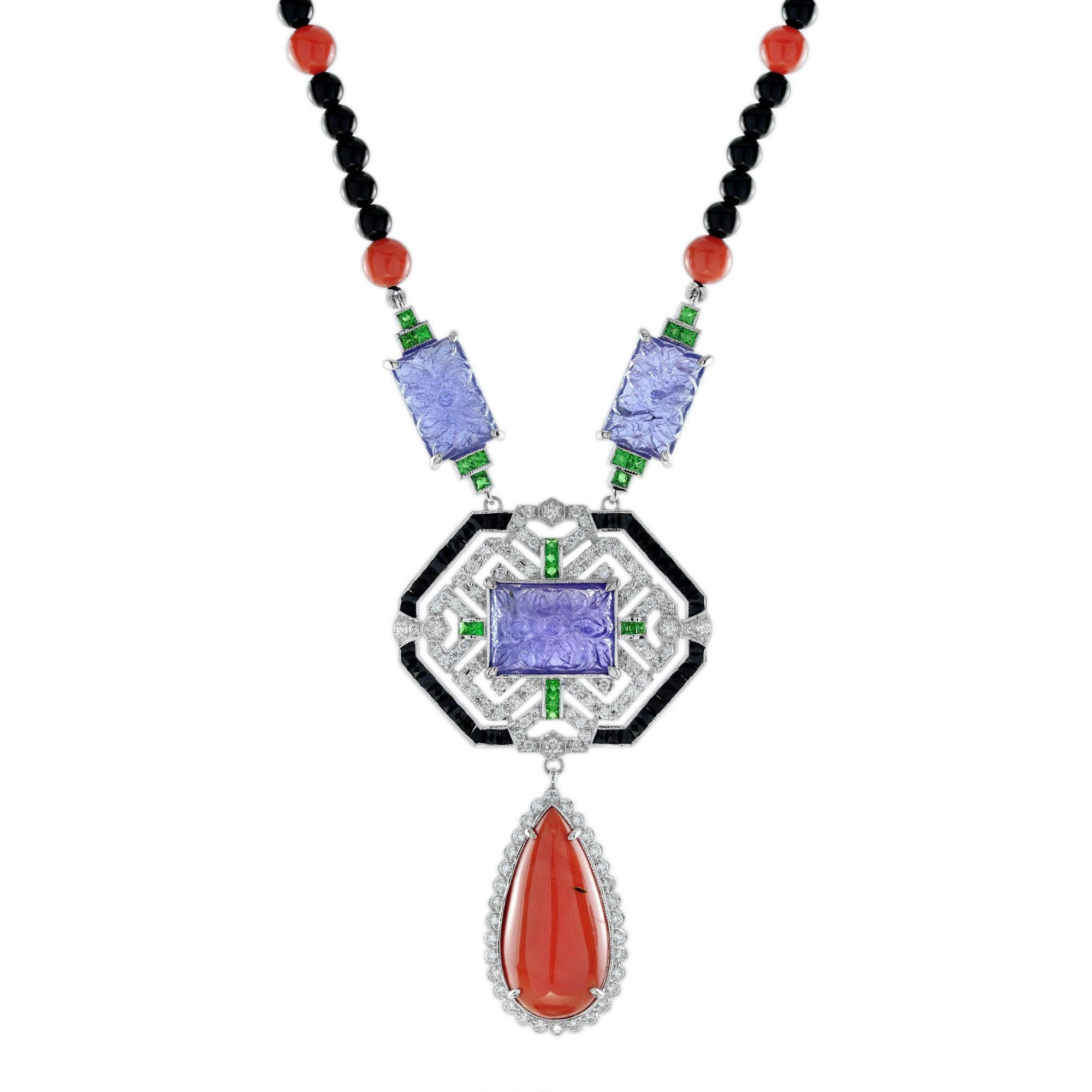 Ce fabuleux collier d'inspiration Art Deco est un trésor unique à ajouter à votre collection. Au centre, une plaque de tanzanite sculptée avec un motif floral d'inspiration asiatique entouré de diamants, d'émeraudes et d'un cadre en onyx suspendu à