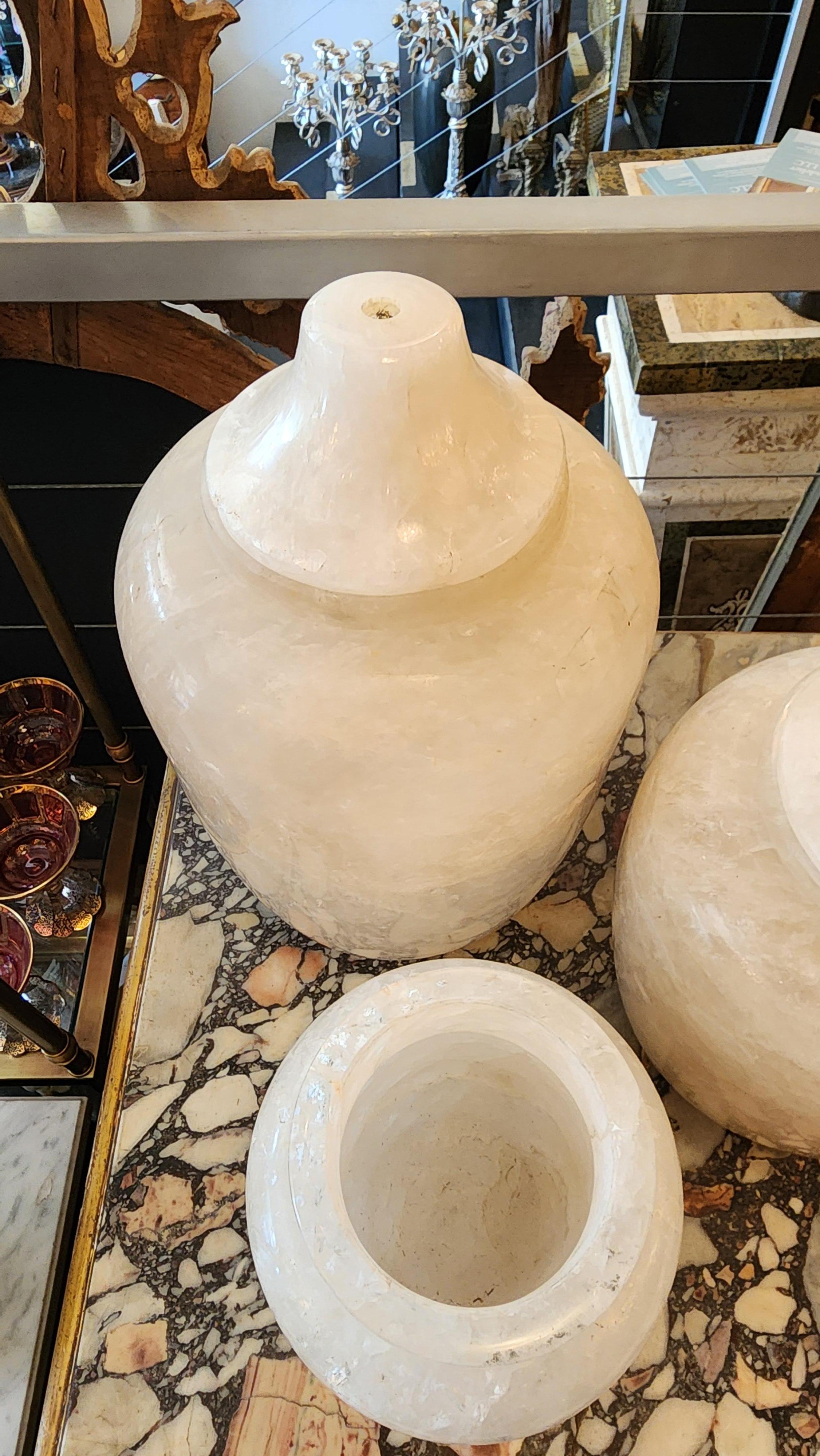 This listing features a set of 3 carved rock crystal vases, varying in sizes. 

Small vase is 5.75