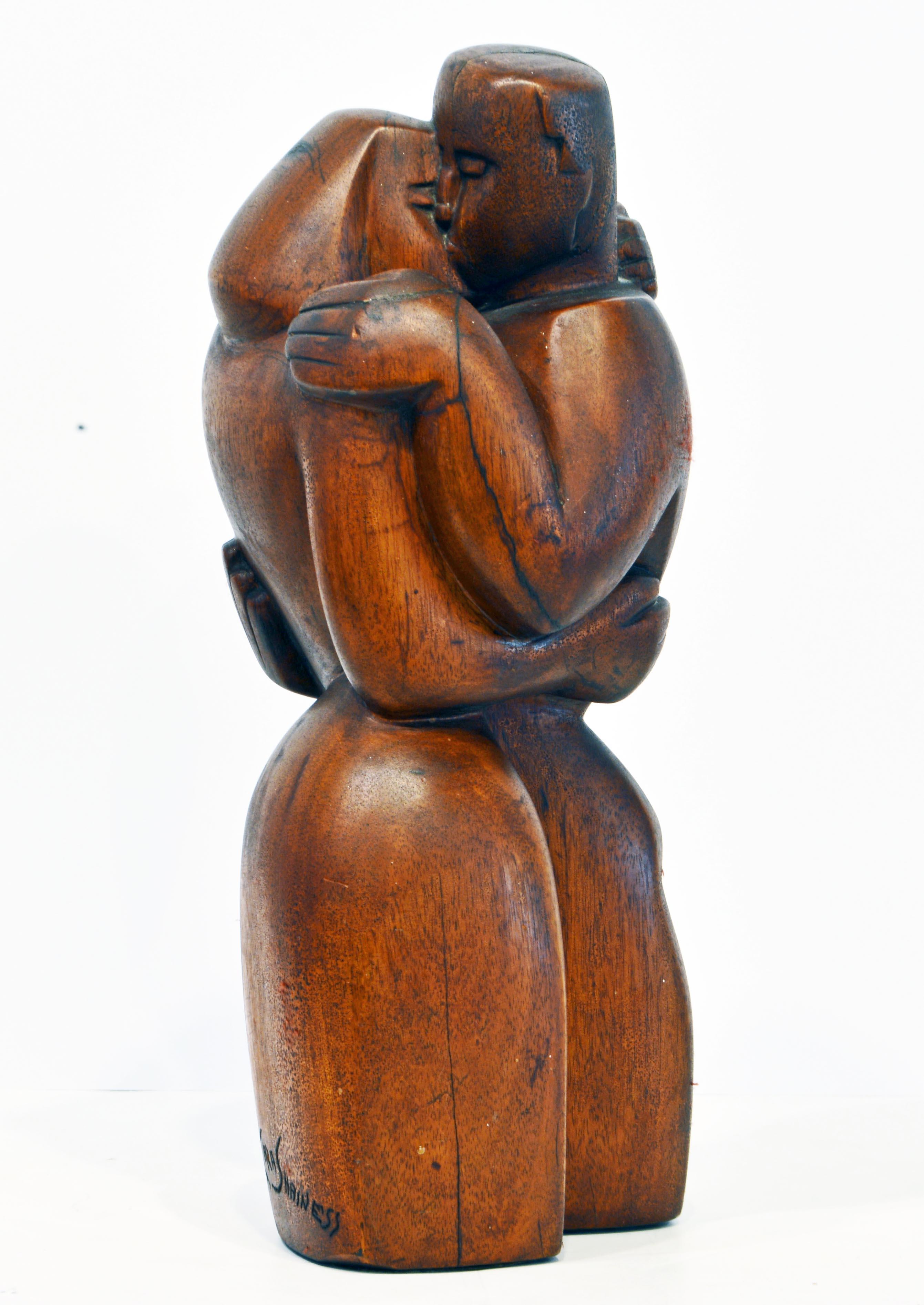 Standing 16 inches tall this fine sculptural work carved in mahogany by New York artist Clara Shainess is titled 'Farewell' by the artist and the cubist inspired form exudes a distinct feeling of both love and sadness. It likely dates to circa