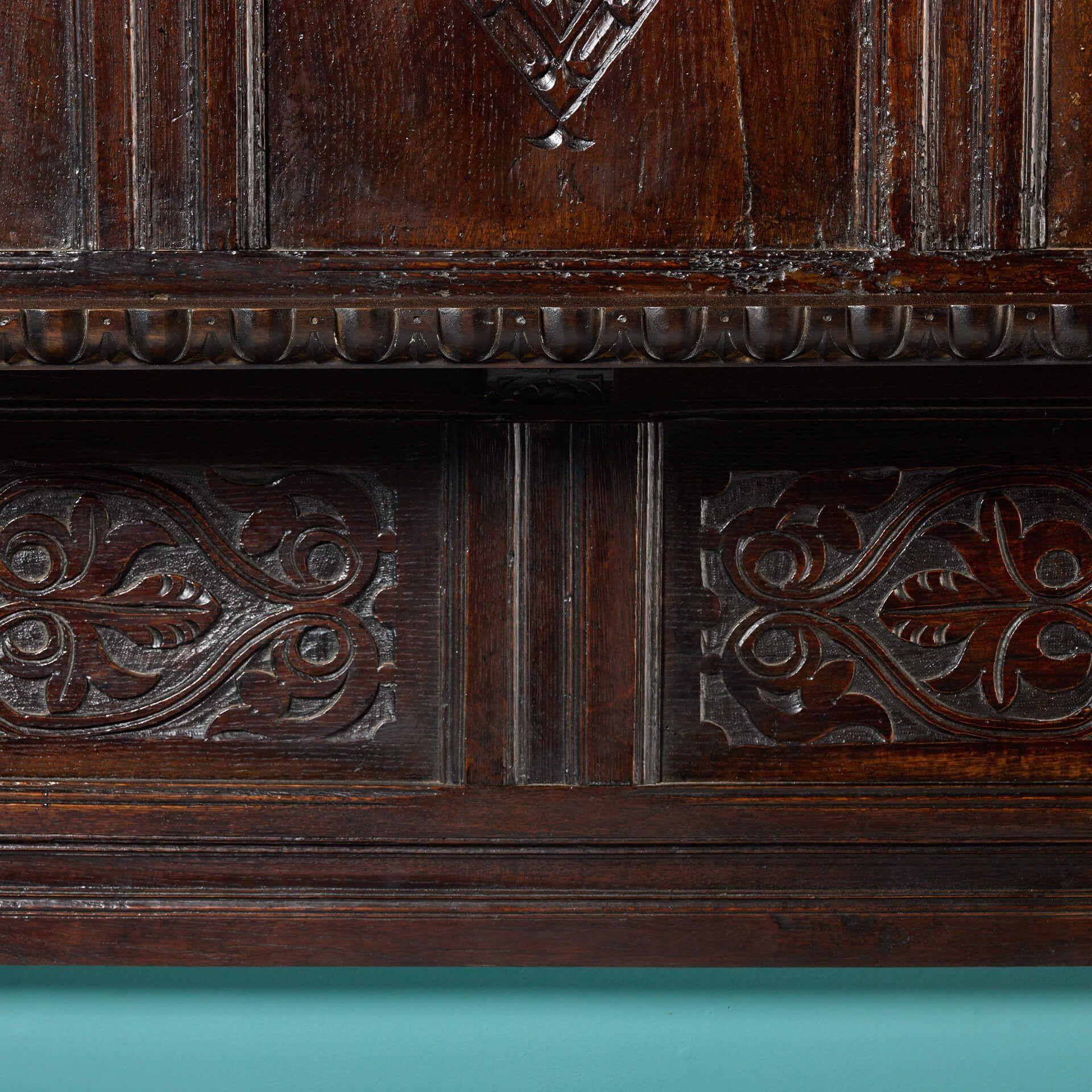 English Carved Dark Oak Tudor Fireplace with Overmantel