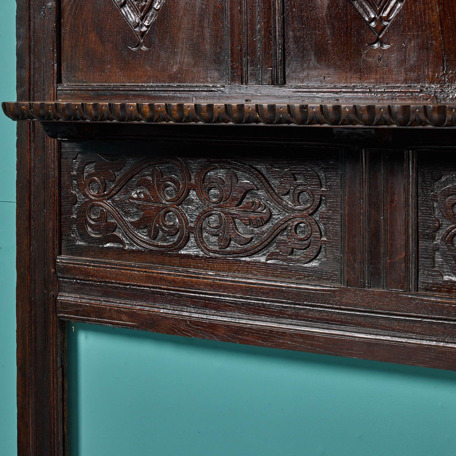 Carved Dark Oak Tudor Fireplace with Overmantel In Fair Condition In Wormelow, Herefordshire