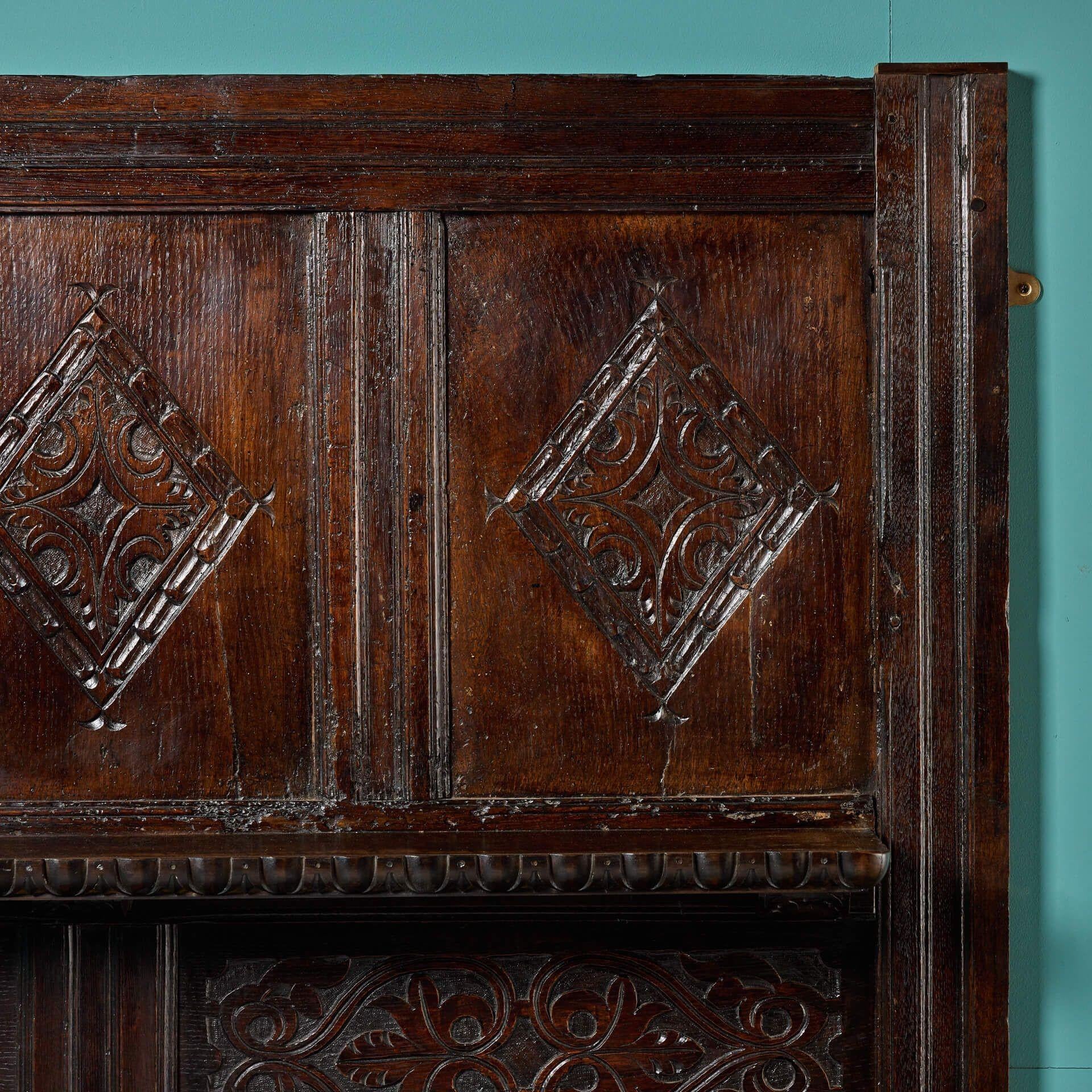 17th Century Carved Dark Oak Tudor Fireplace with Overmantel