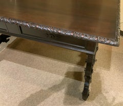 Carved desk from Spain with hand carving and iron stretcher