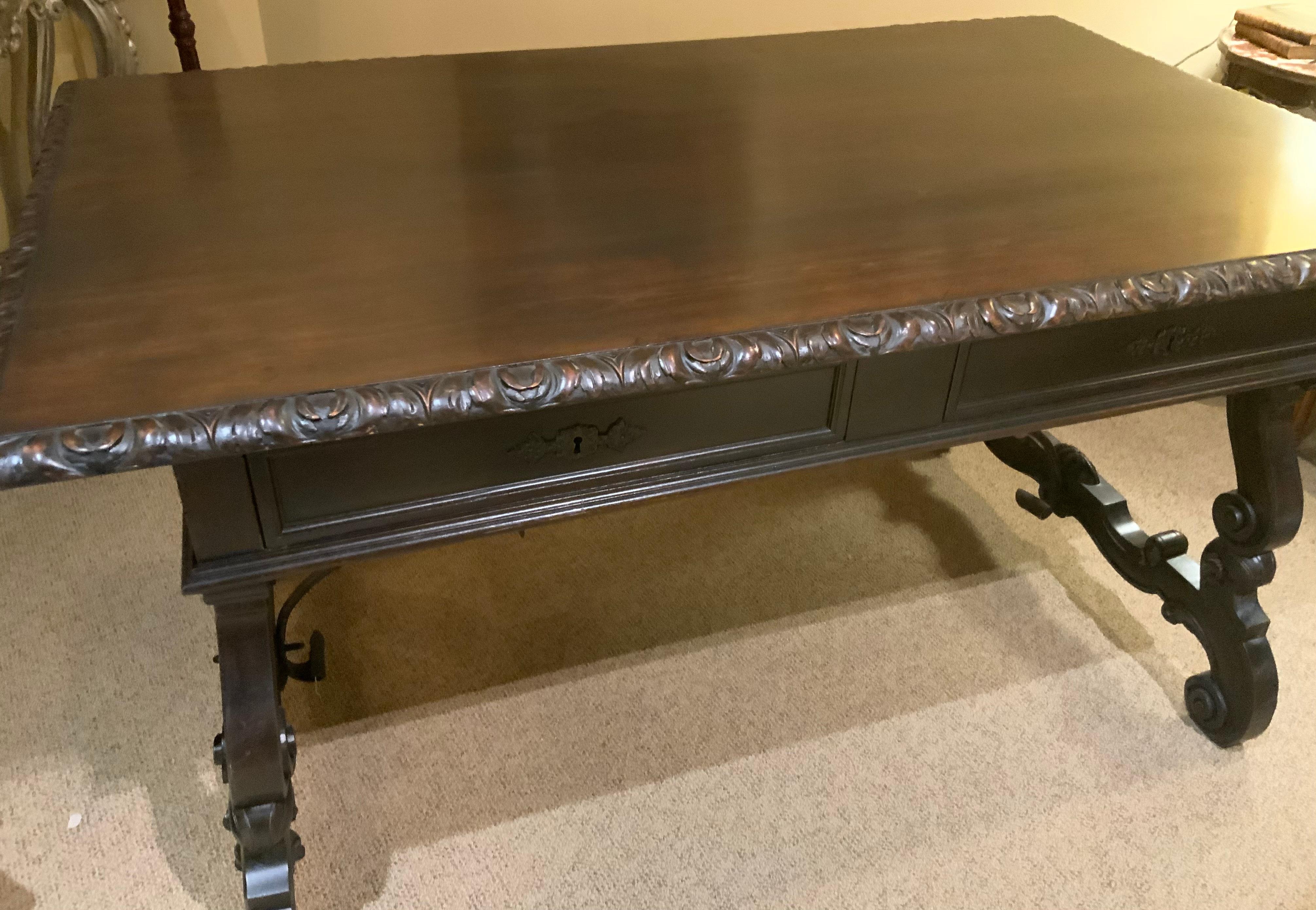 Renaissance Carved desk from Spain with hand carving and iron stretcher  For Sale