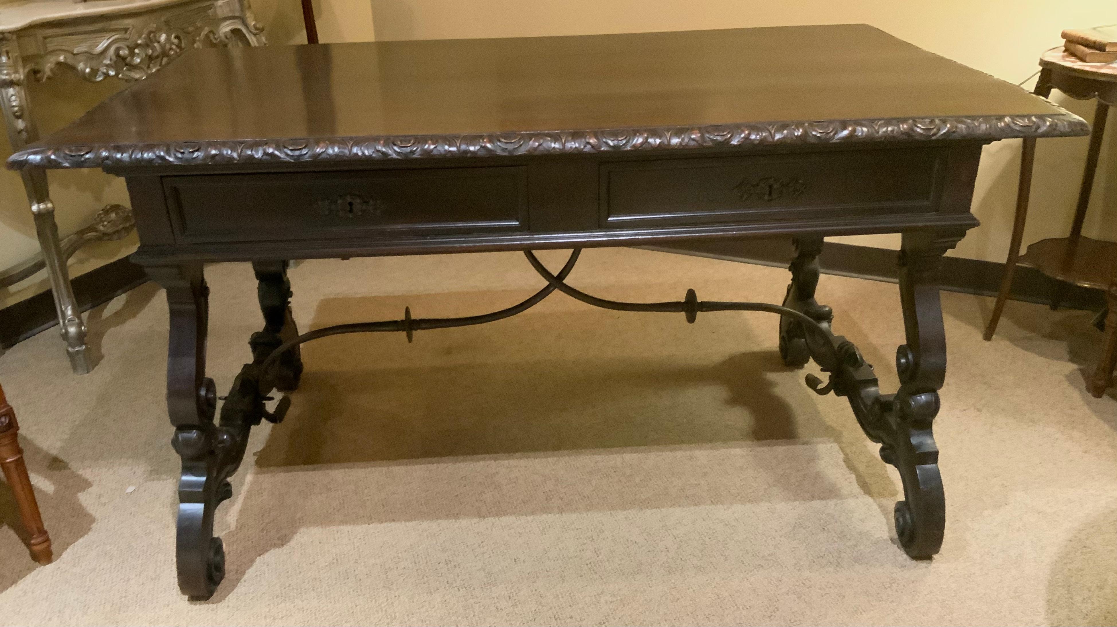19th Century Carved desk from Spain with hand carving and iron stretcher  For Sale
