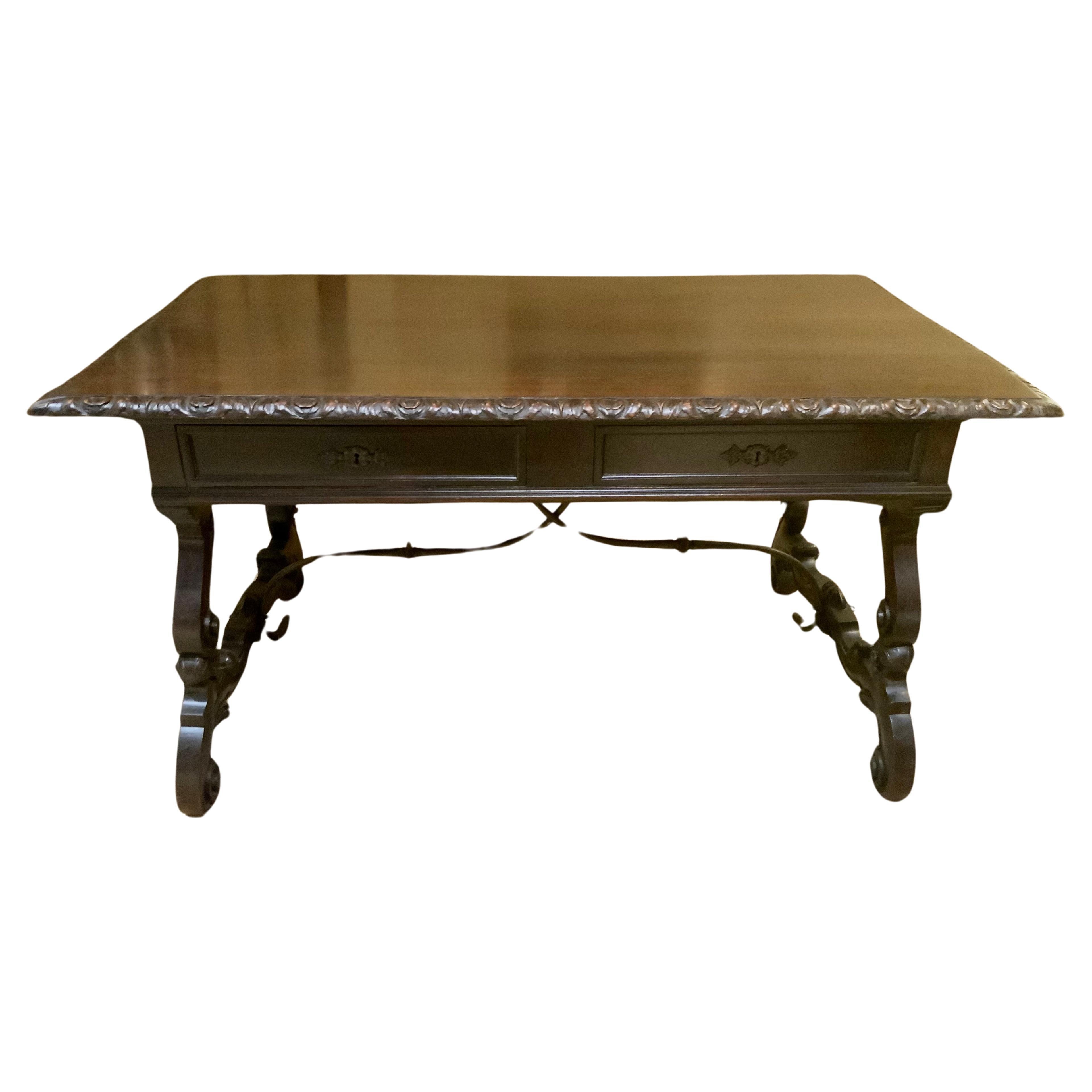 Carved desk from Spain with hand carving and iron stretcher 