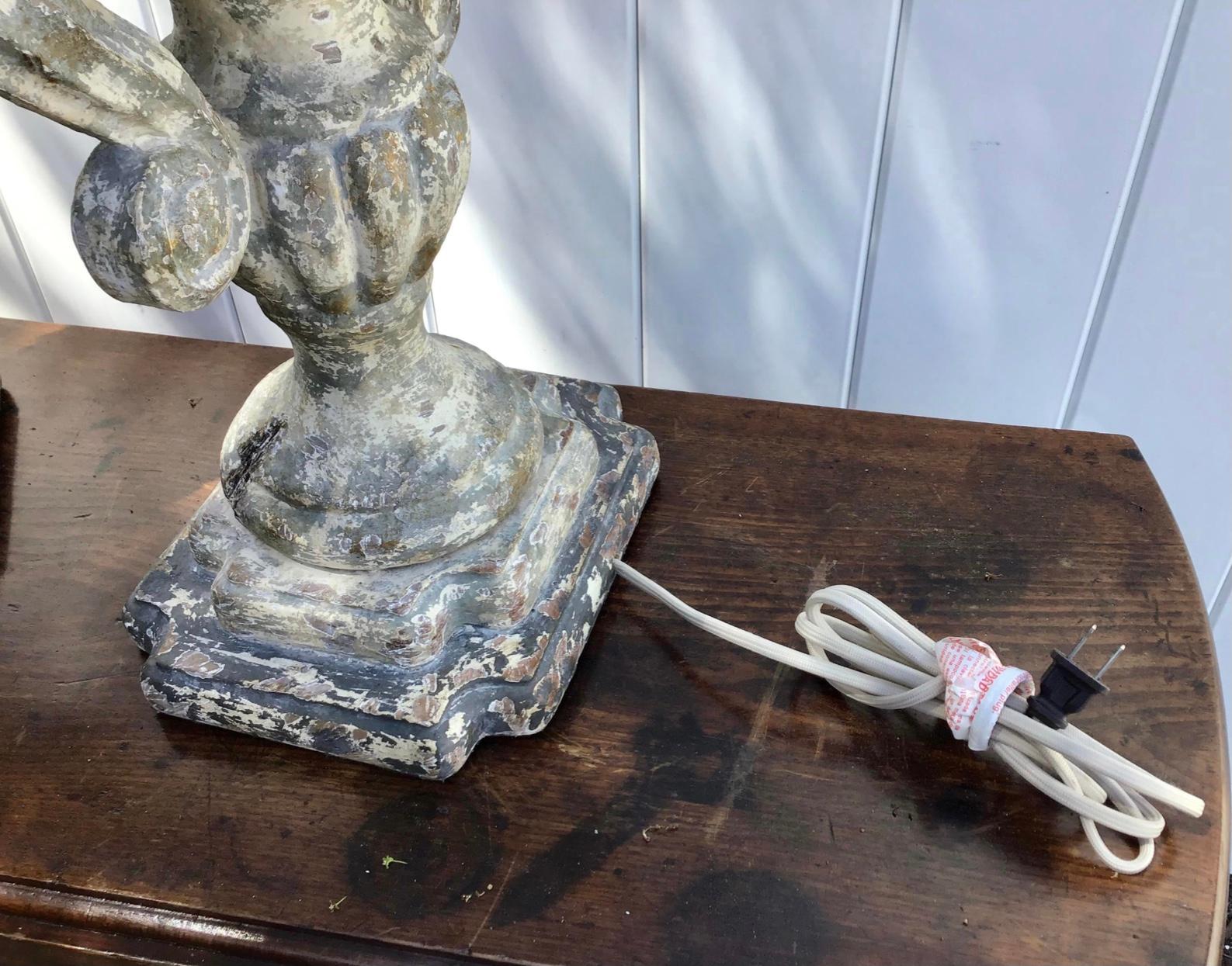 carved and distressed table lamp