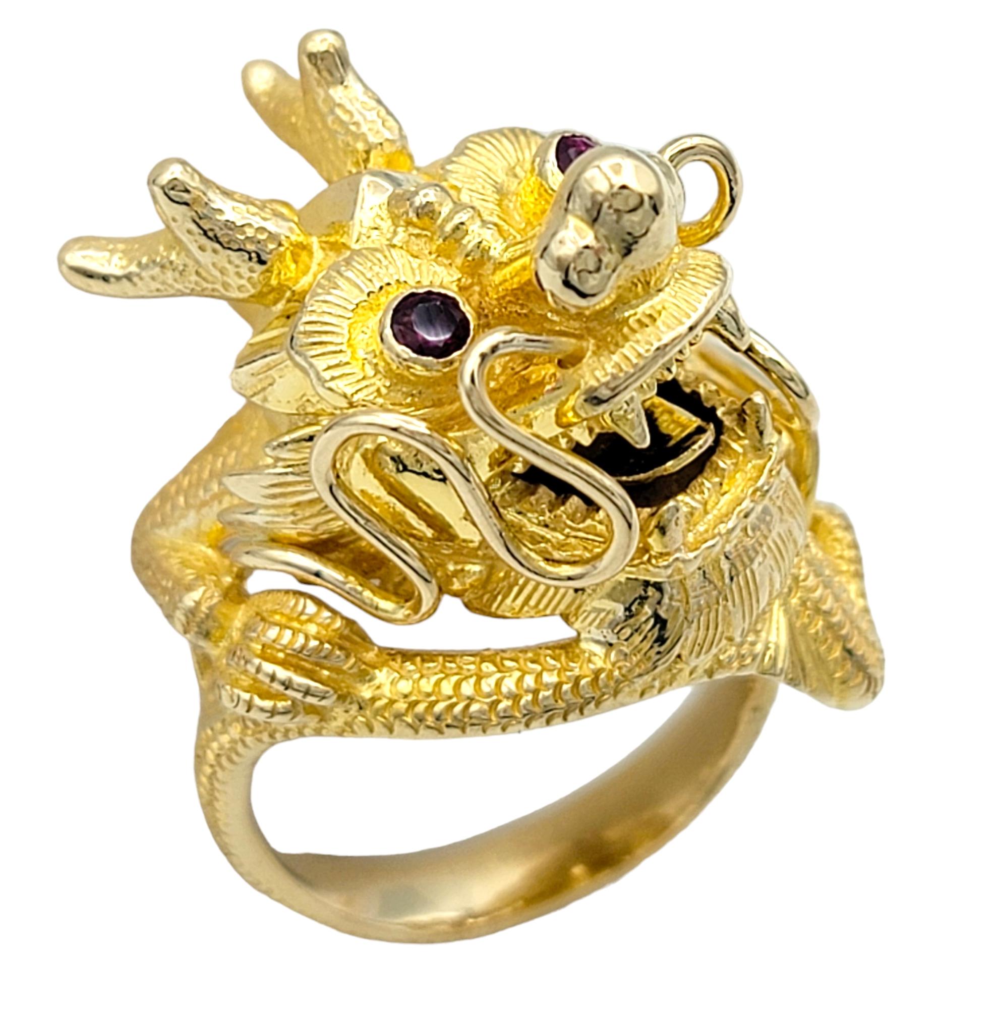 Ring Size: 6.5

This striking dragon head cocktail ring is expertly crafted in 14 karat yellow gold. The bold and intricate piece features a detailed dragon head design, showcasing exceptional artistry and craftsmanship.

The dragon's eyes are
