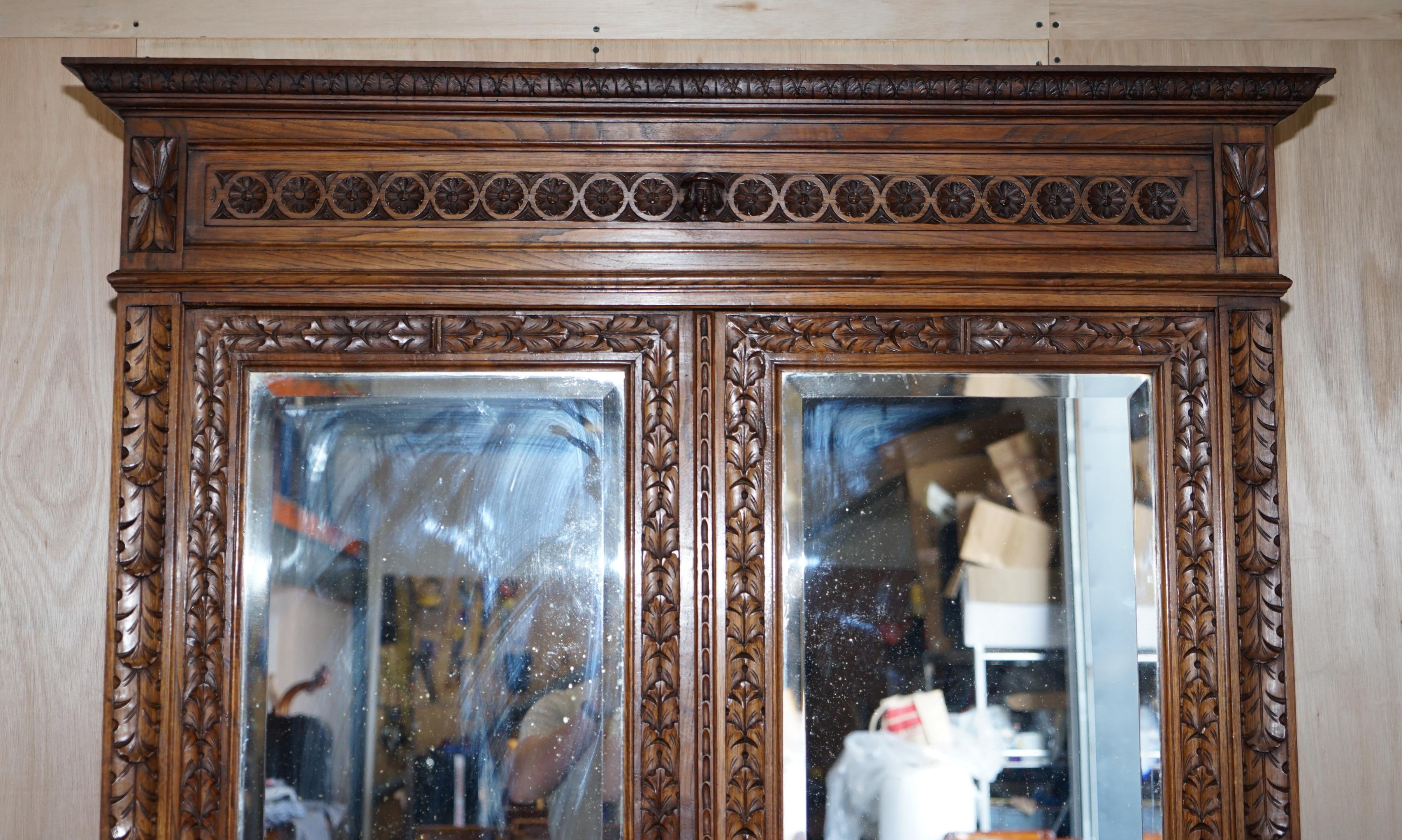 High Victorian Carved Dutch Antique circa 1880 Armoire Folded Lined Wardrobe Mirrored Doors For Sale