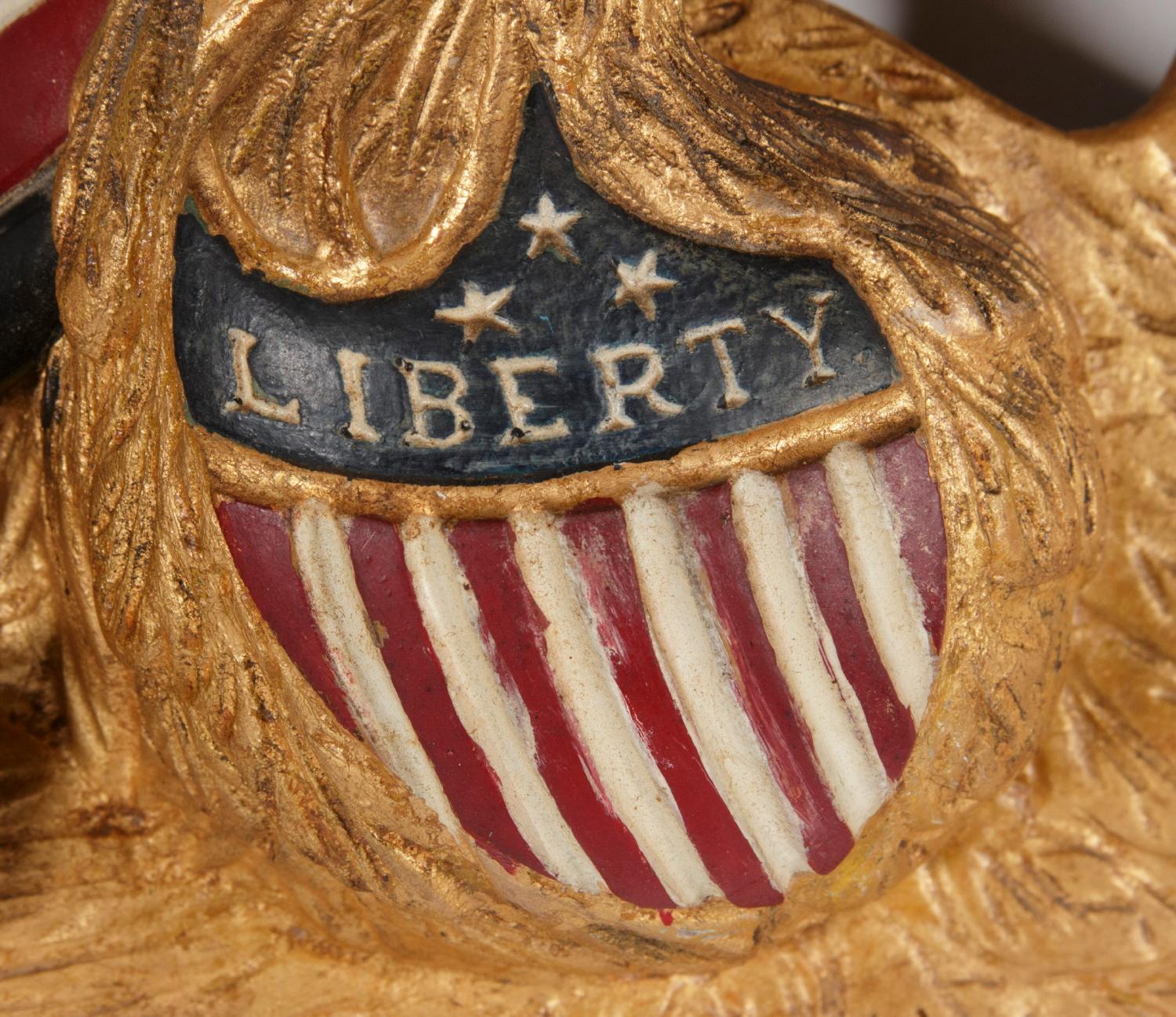CARVED EAGLE BY GEORGE STAPF, HARRISBURG, PENNSYLVANIA, AN UNUSUALLY FINE EXAMPLE WITH A STAR IN ITS BEAK AND A SHIELD IN RELIEF ON ITS BREAST WITH THE WORD 