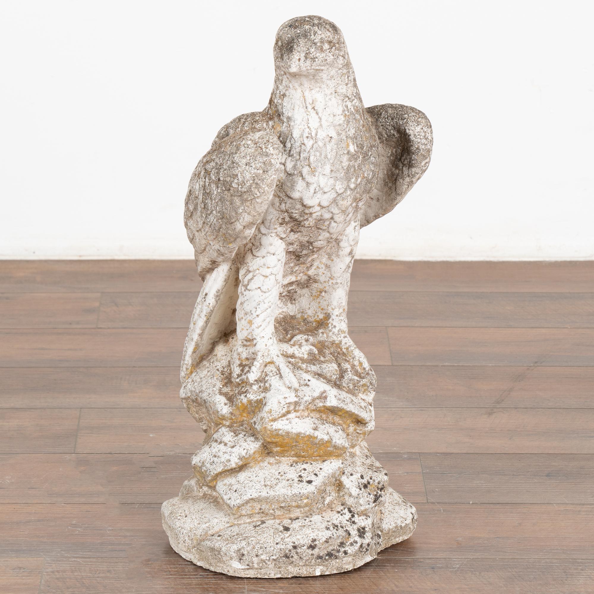 This old limestone eagle statute features handsome carved details, including the nicely textured feathers.
The stone has an expected aged patina, pitting and lichen/stains throughout.
Please note that this piece is solid and quite heavy, and ready