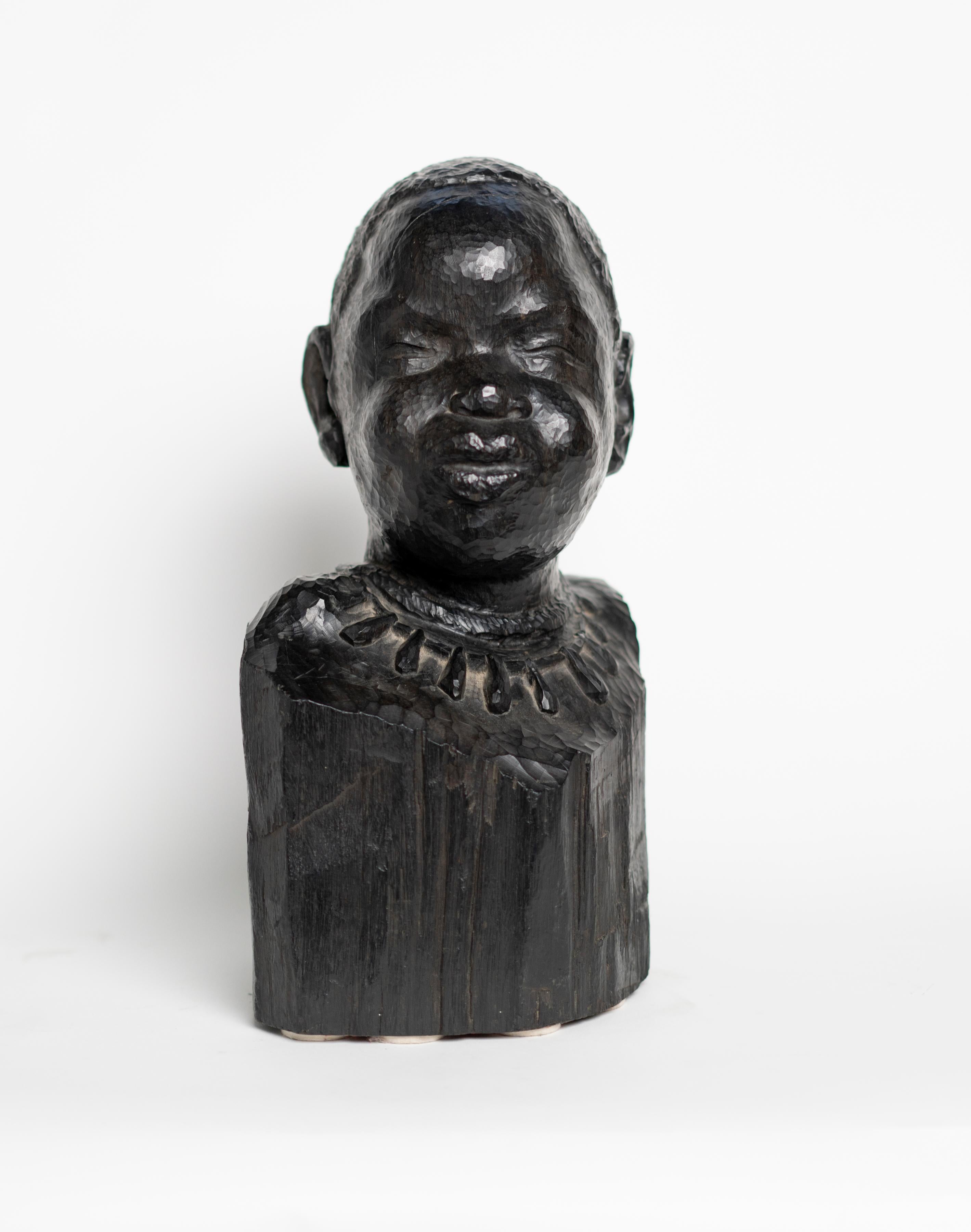 Sculpted carved stained oak of an African Woman by Ferdinand Parpan.
 Signed: 