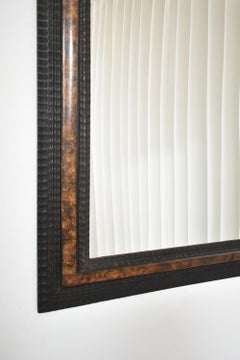 Carved ebonised wood mirror and trompe l'oeil turshell, XIXth c.