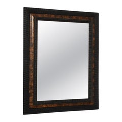 Carved ebonised wood mirror and trompe l'oeil turshell, XIXth c.