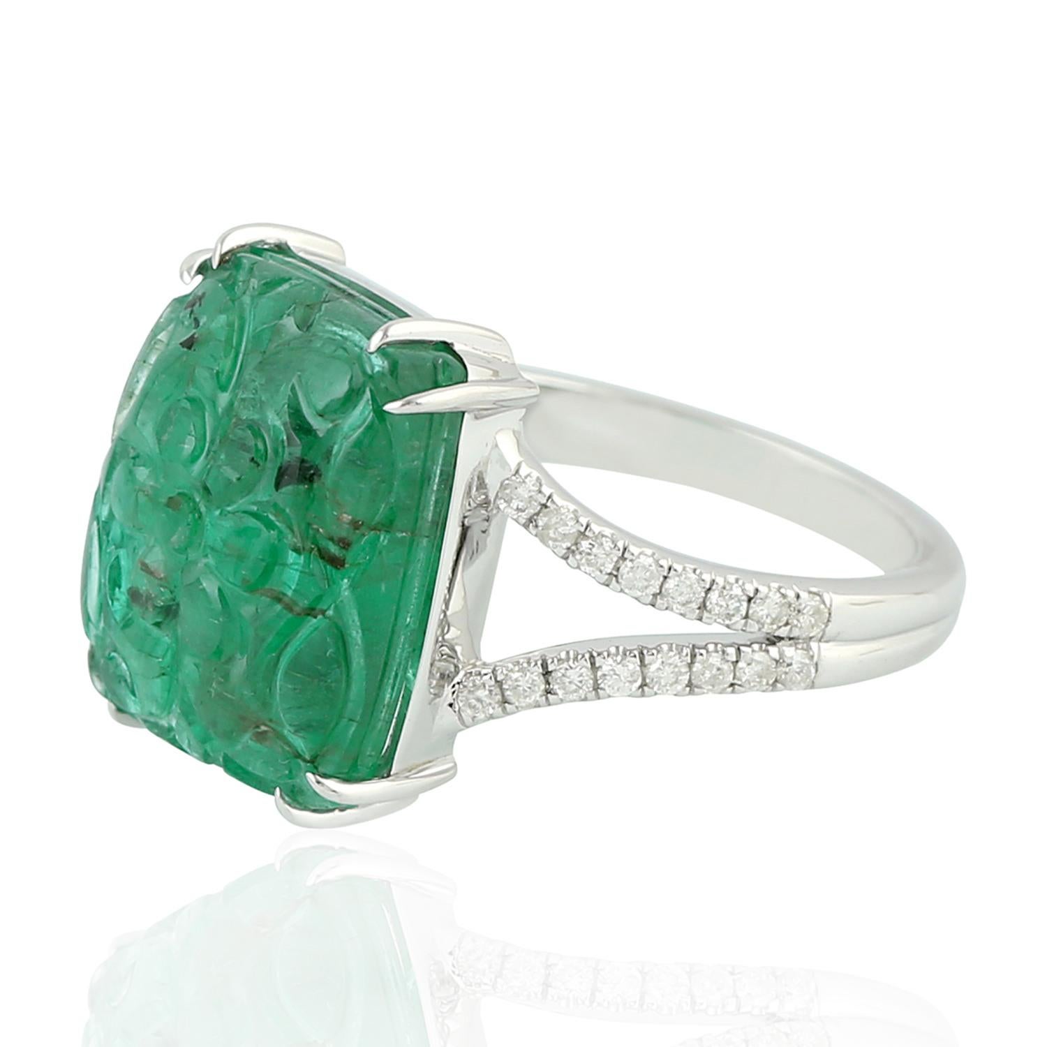 This ring has been meticulously crafted from 18-karat gold. It is hand set in 8.16 carats carved emerald & .24 carats of diamonds. 

The ring is a size 7 and may be resized to larger or smaller upon request. 
FOLLOW  MEGHNA JEWELS storefront to view