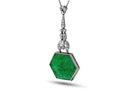 Carved emerald and diamond pendant, circa 1925.