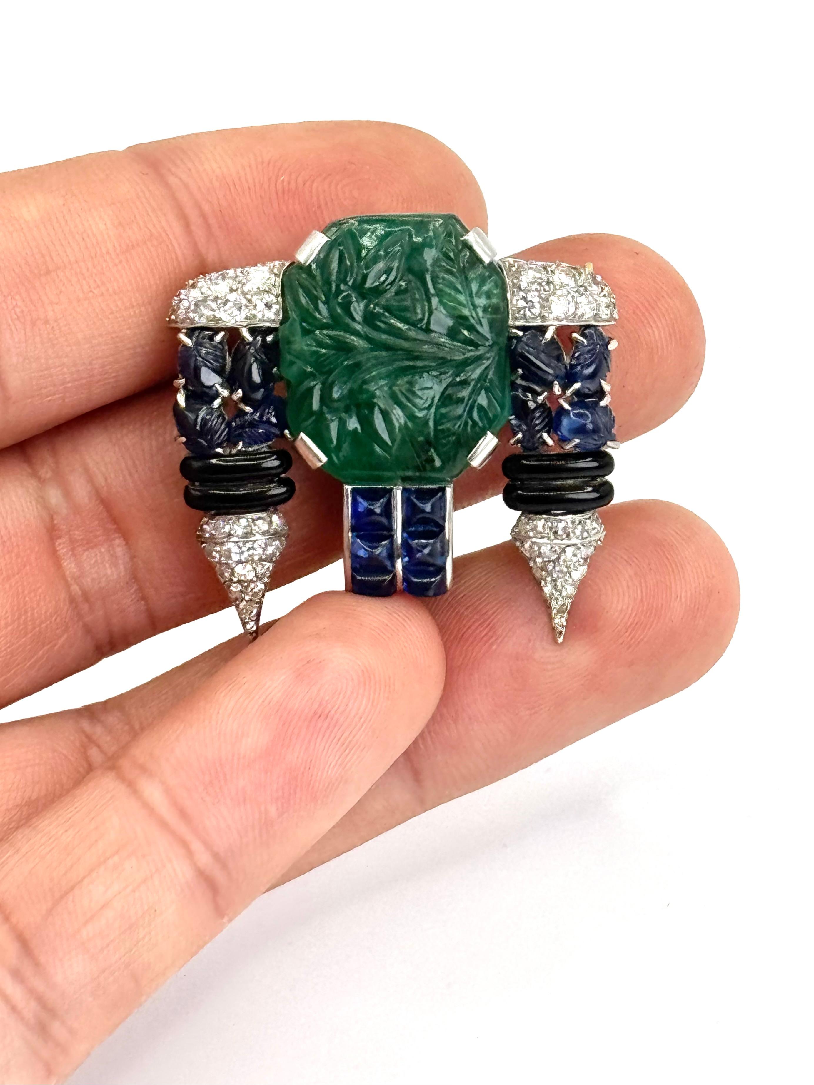 Round Cut Art Deco Carved Emerald, Sapphire, Onyx & Diamond Brooch For Sale