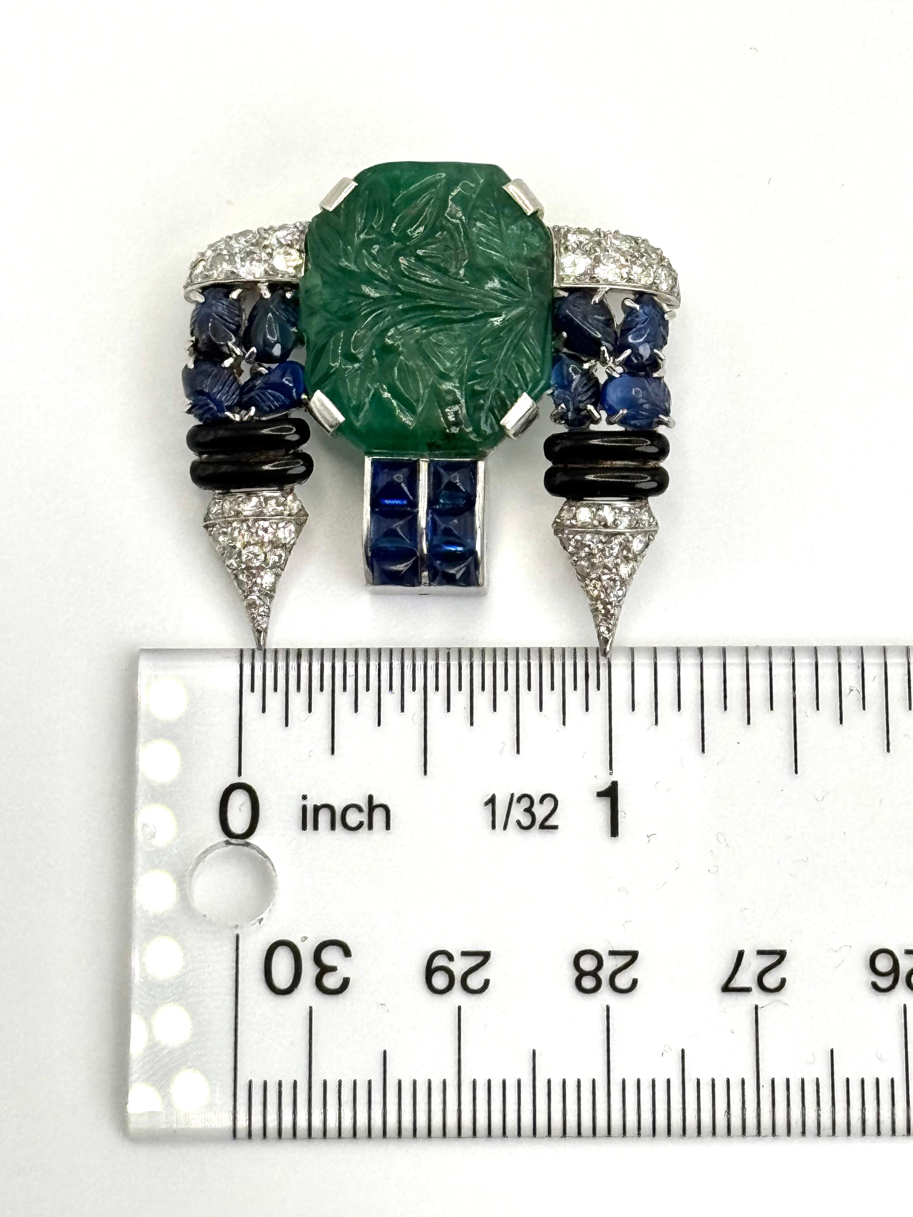 Art Deco Carved Emerald, Sapphire, Onyx & Diamond Brooch In Excellent Condition For Sale In Great Neck Plaza, NY